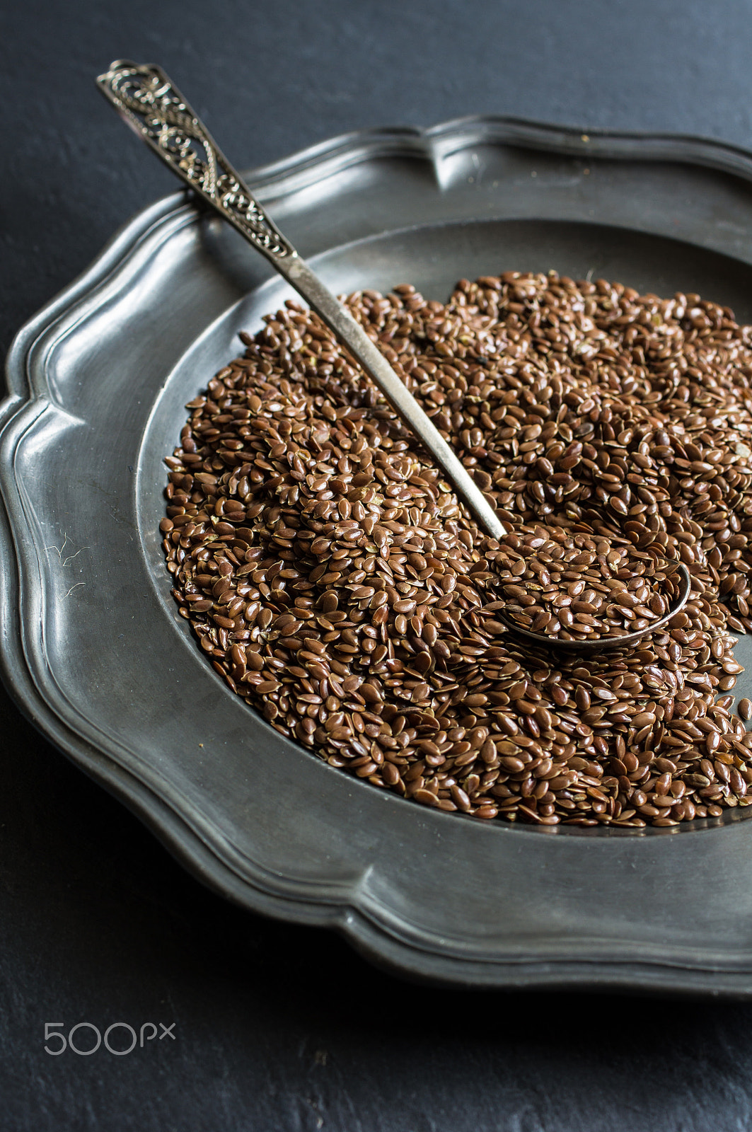 Sony SLT-A55 (SLT-A55V) + Sony DT 30mm F2.8 Macro SAM sample photo. Flax seeds on black board photography