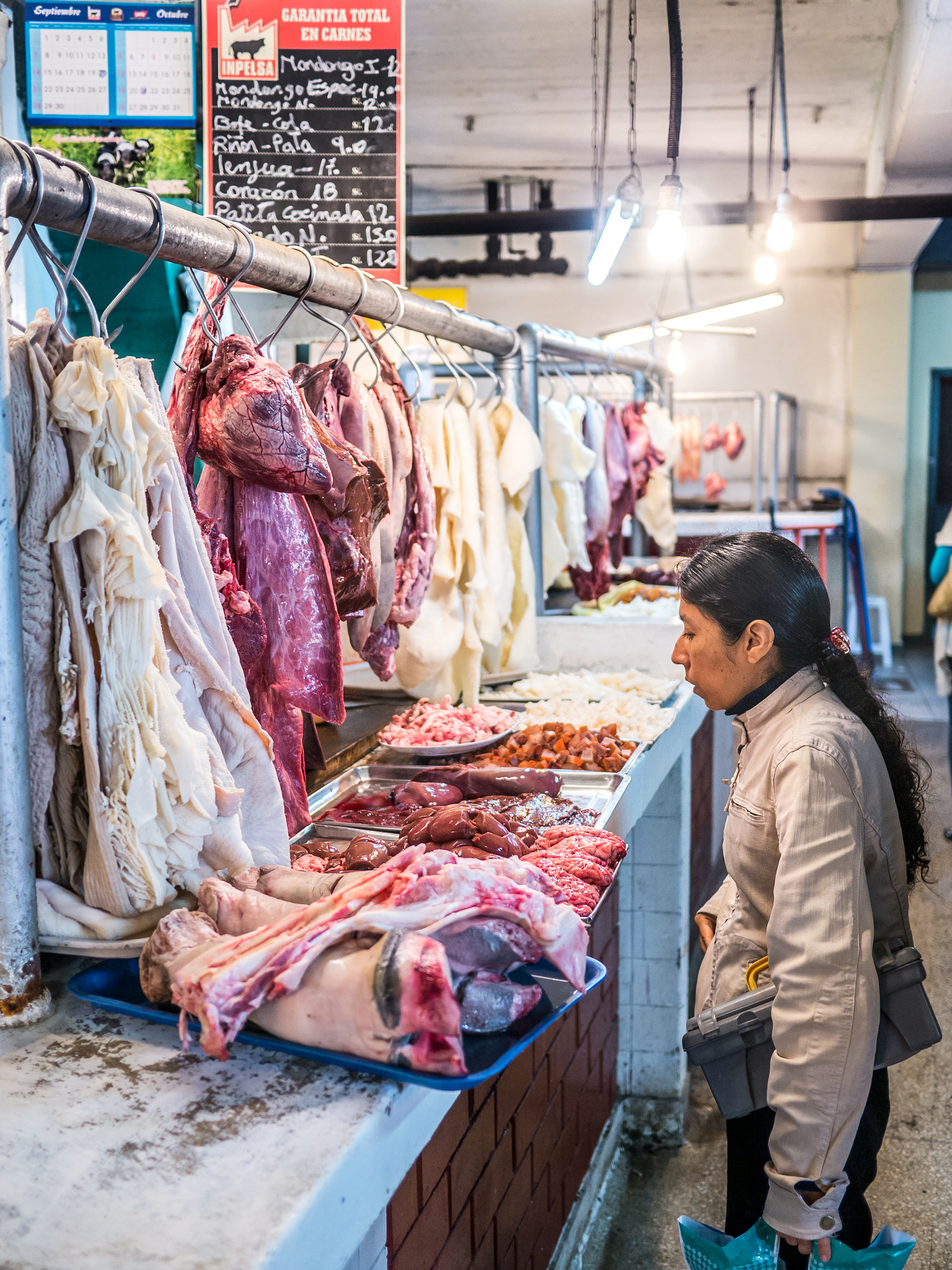 Panasonic Lumix DMC-G5 + Panasonic Lumix G 20mm F1.7 ASPH sample photo. Buying meat on the market photography