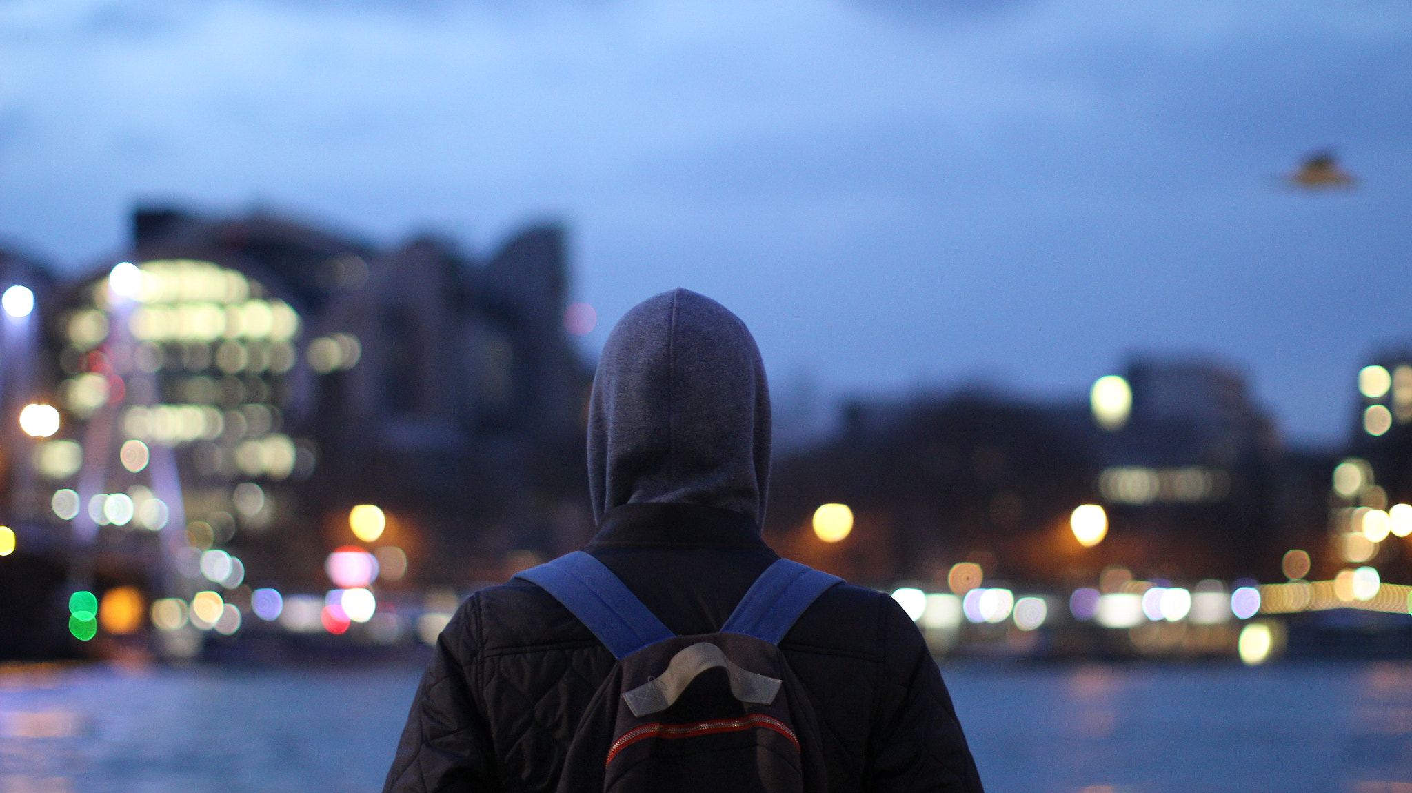 Canon EOS 100D (EOS Rebel SL1 / EOS Kiss X7) + Canon EF 50mm F1.2L USM sample photo. A moody portrait shot as part of an art film on london's southwark embankment photography