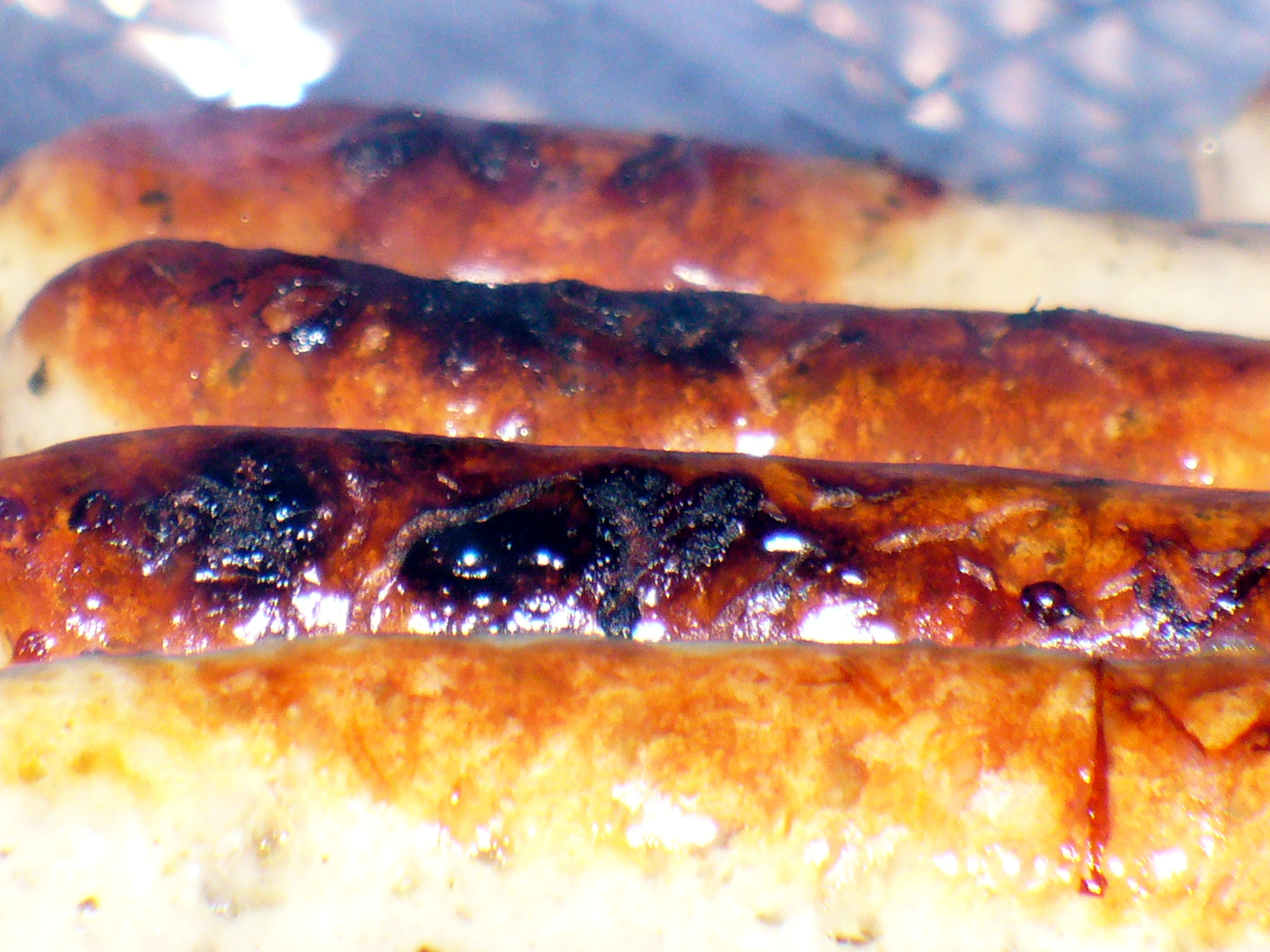 Panasonic DMC-LZ5 sample photo. Three nuremberg bratwursts on a grill photography