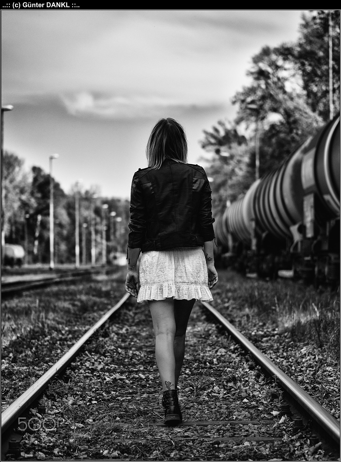 Panasonic Lumix G 42.5mm F1.7 ASPH Power OIS sample photo. Girl on railway photography