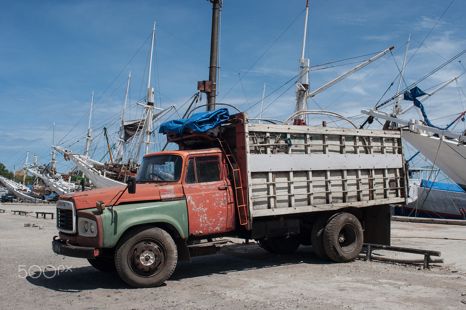 Nikon D90 + Nikon AF Nikkor 24mm F2.8D sample photo. A truck parked at paotere harbor in makassar, indonesia. photography