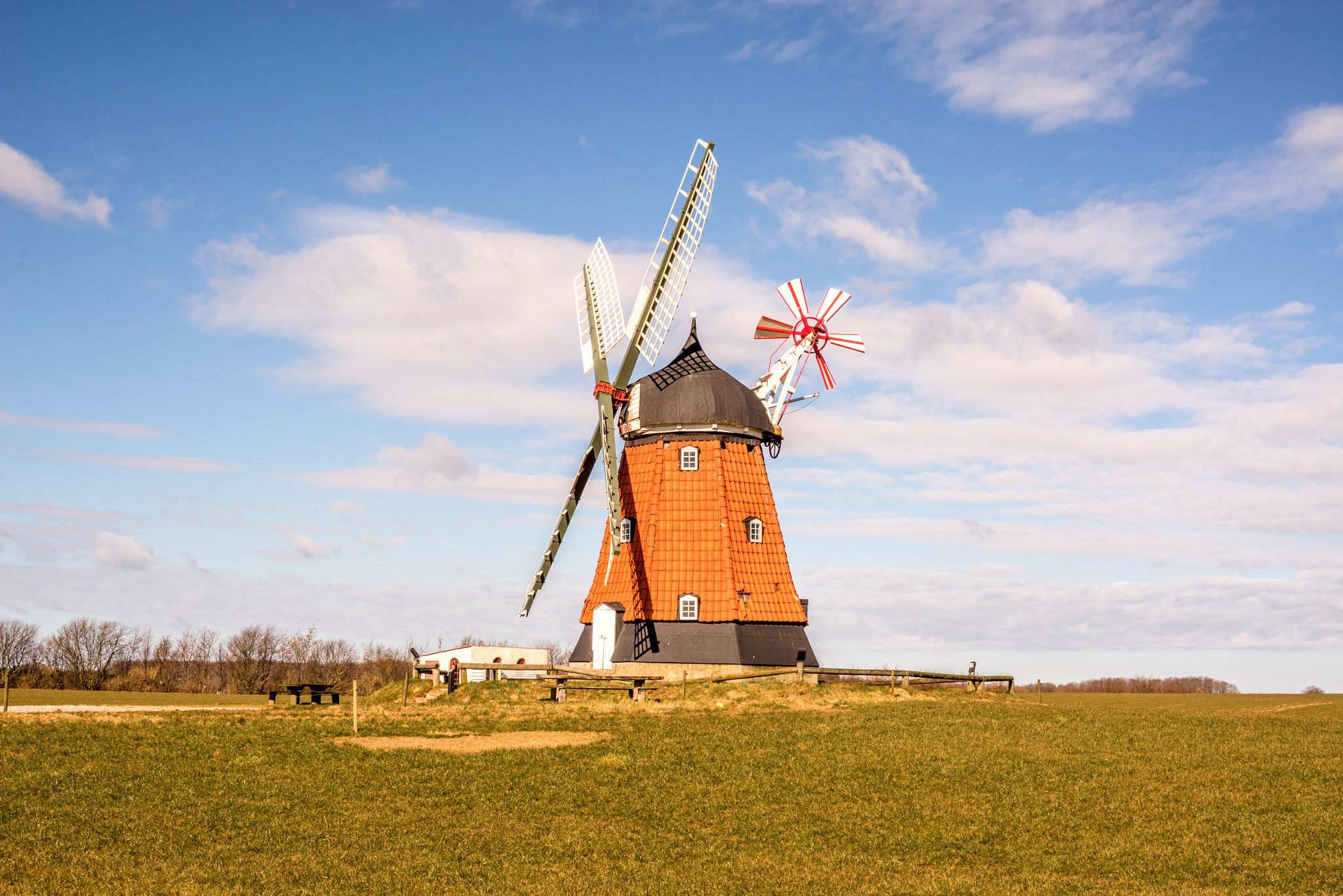 Sony a7R + Sony 50mm F1.4 sample photo. Old mill on a green meadow photography