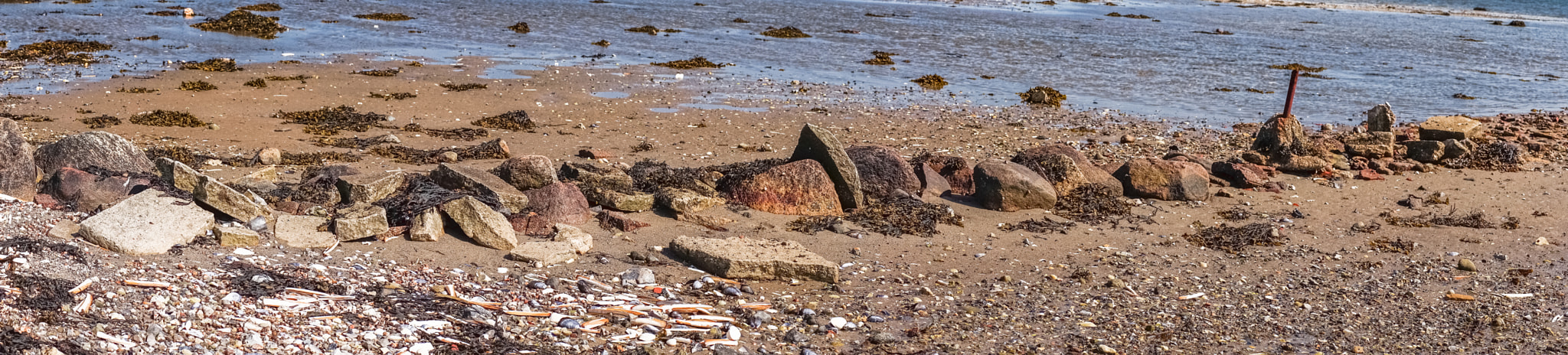 Sony a7R + Minolta AF 50mm F1.4 [New] sample photo. Pebbles on a beach in panorama photography