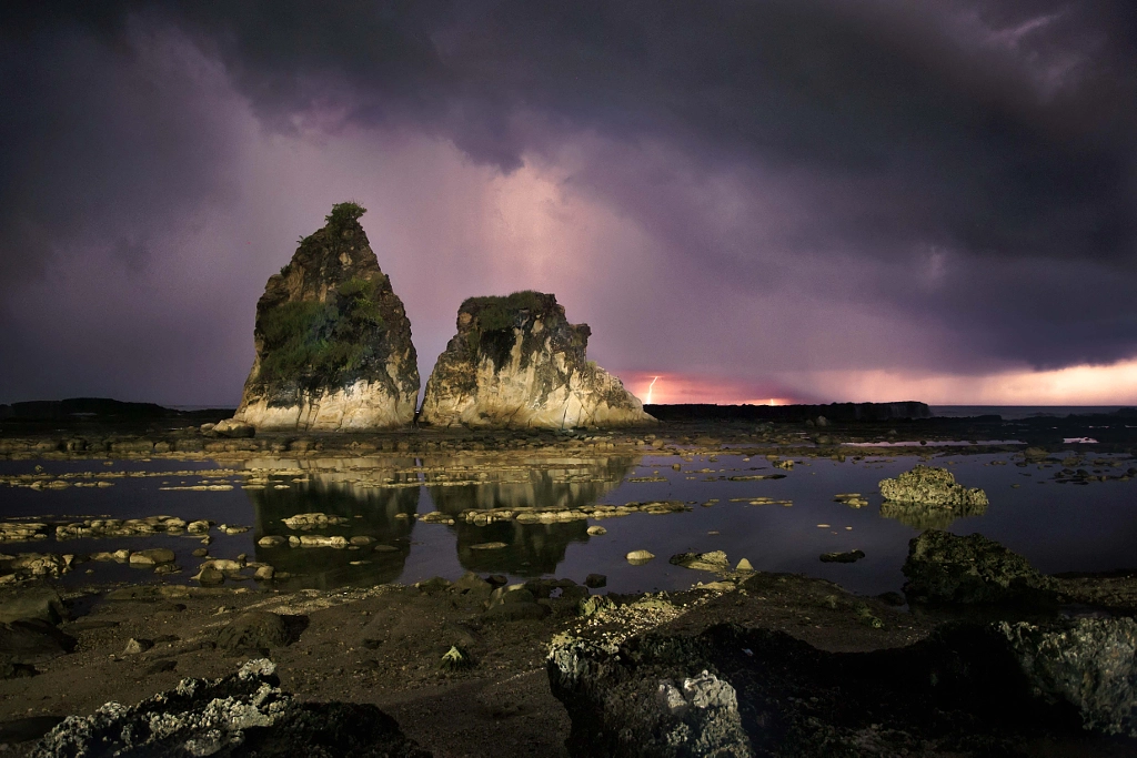 Sawarna beach with thunder and lighting by Ivan Lee on 500px.com