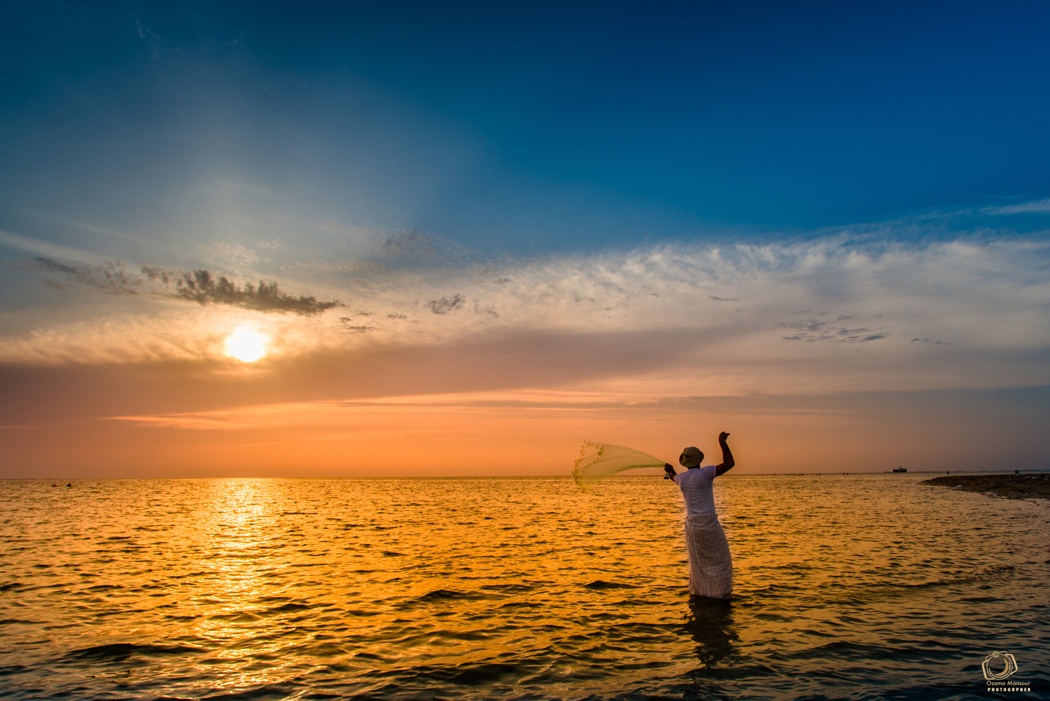Nikon AF Nikkor 14mm F2.8D ED sample photo. Fisher man photography