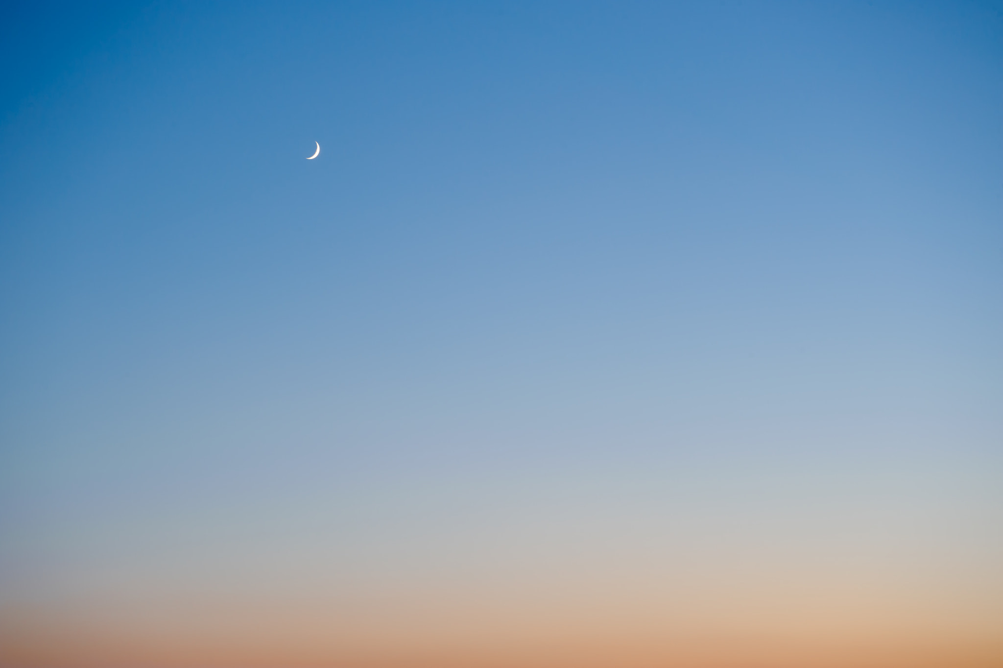 Nikon D3 + AF Zoom-Nikkor 28-80mm f/3.3-5.6G sample photo. Moon at sunset on a clear day photography