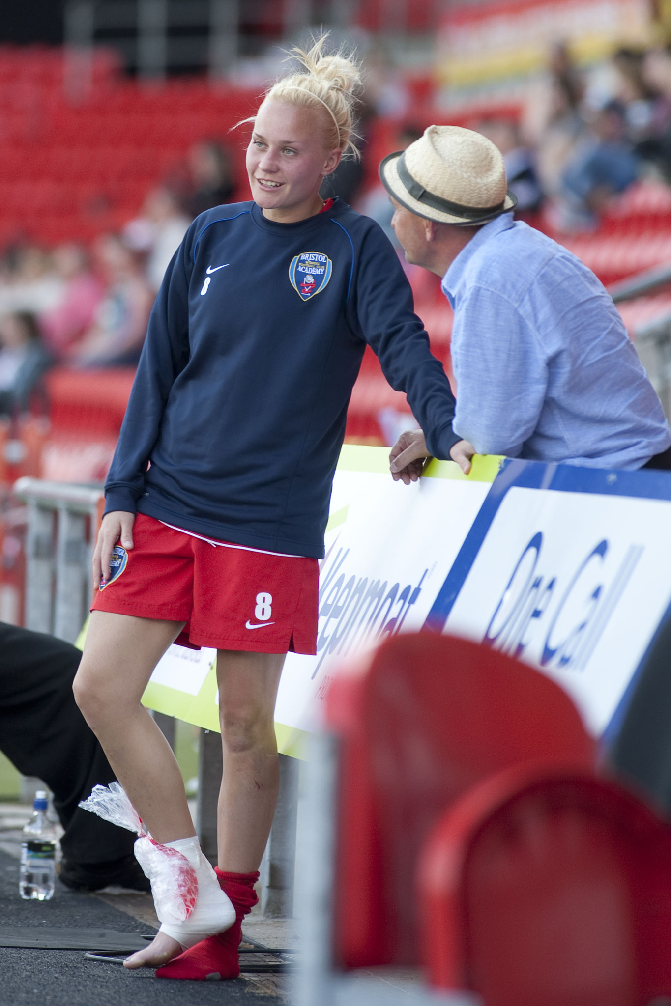 Canon EF 200mm f/1.8L sample photo. Alex windell of bristol talks to a relative about her injury
 - arsenal ladies vs bristol academy... photography