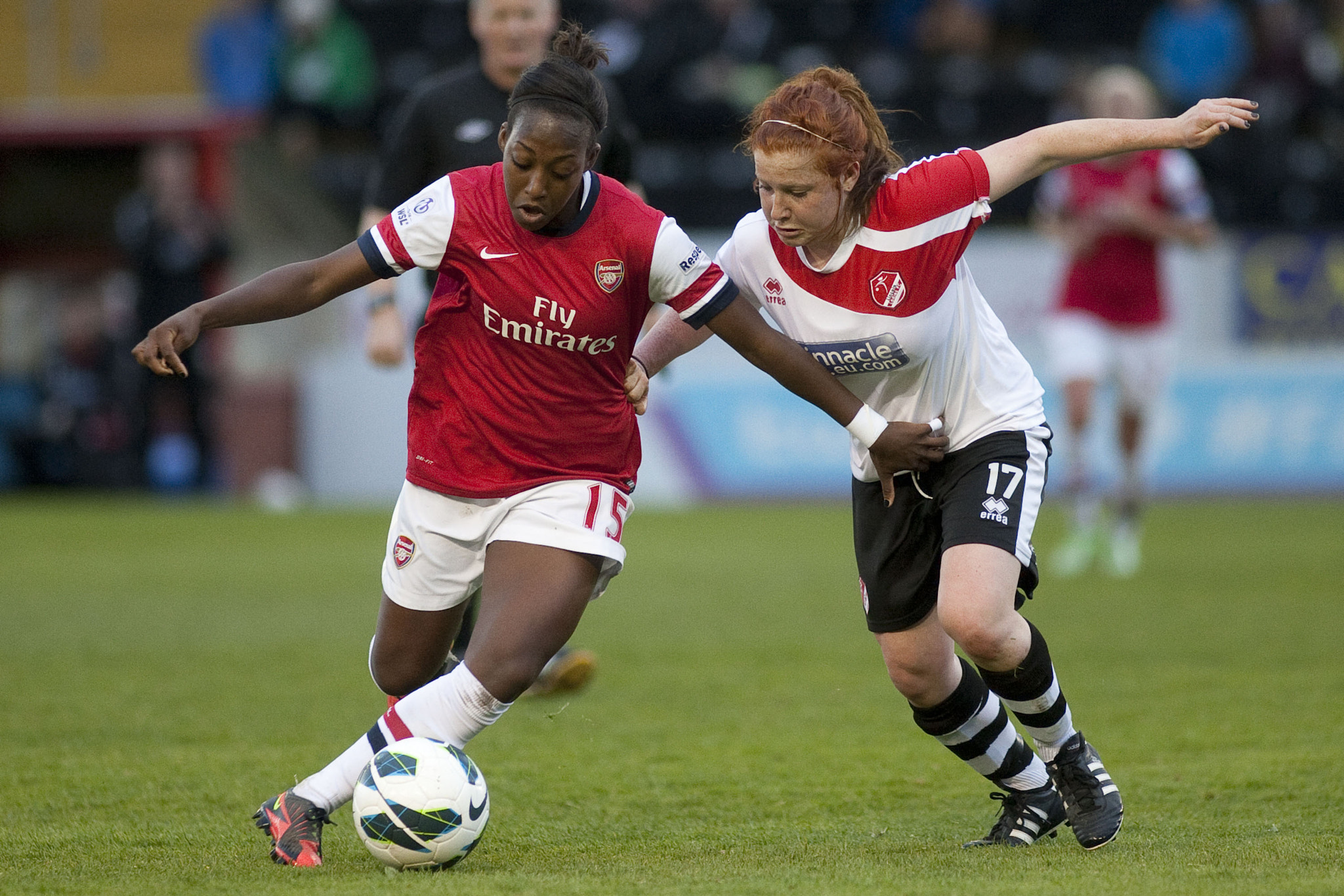 Canon EF 200mm f/1.8L sample photo. Dan carter (arsenal) & martha harris (lincoln) competed hard
 - lincoln ladies vs arsenal ladies... photography