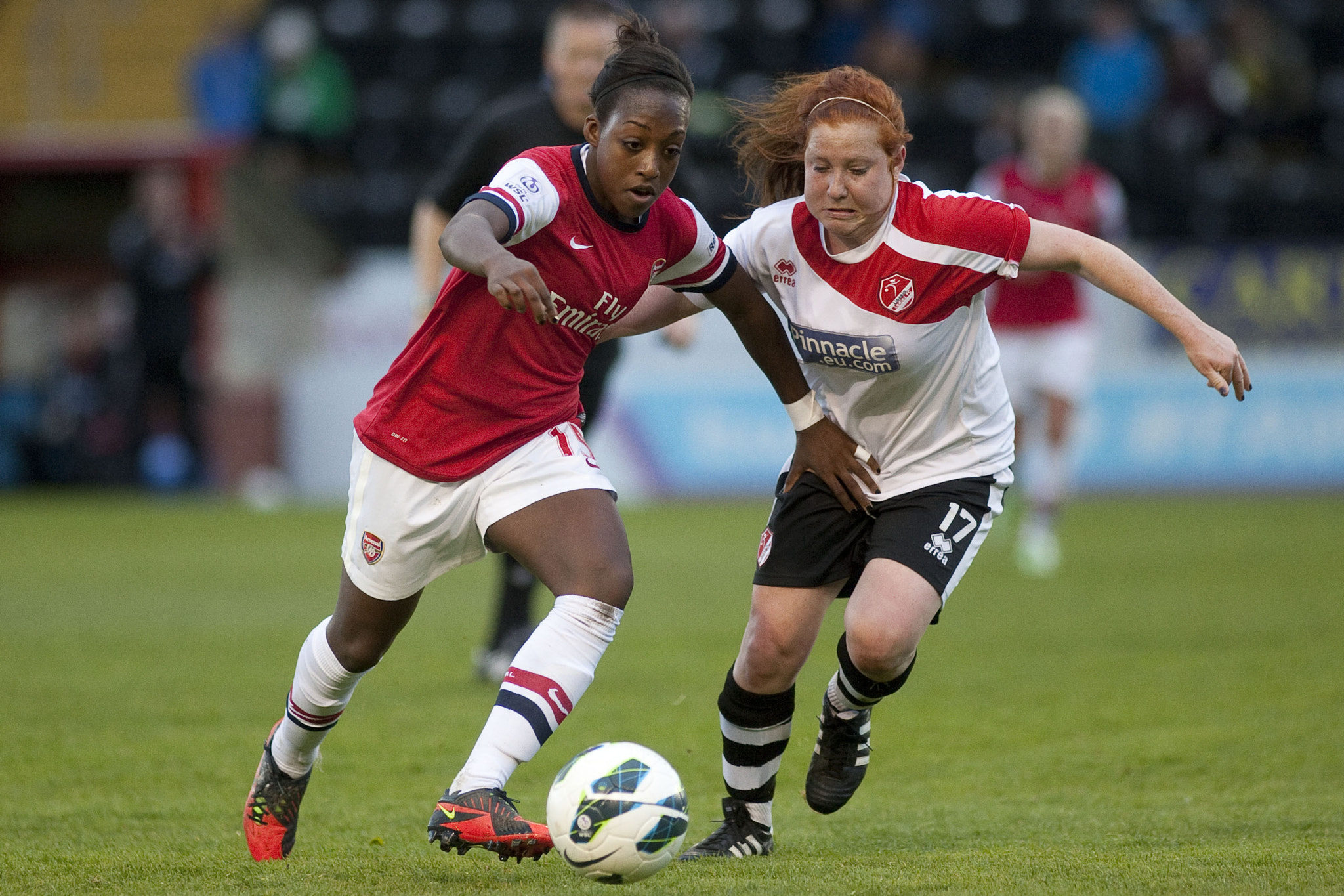 Canon EF 200mm f/1.8L sample photo. Dan carter (arsenal) & martha harris (lincoln) competed hard
 - lincoln ladies vs arsenal ladies... photography