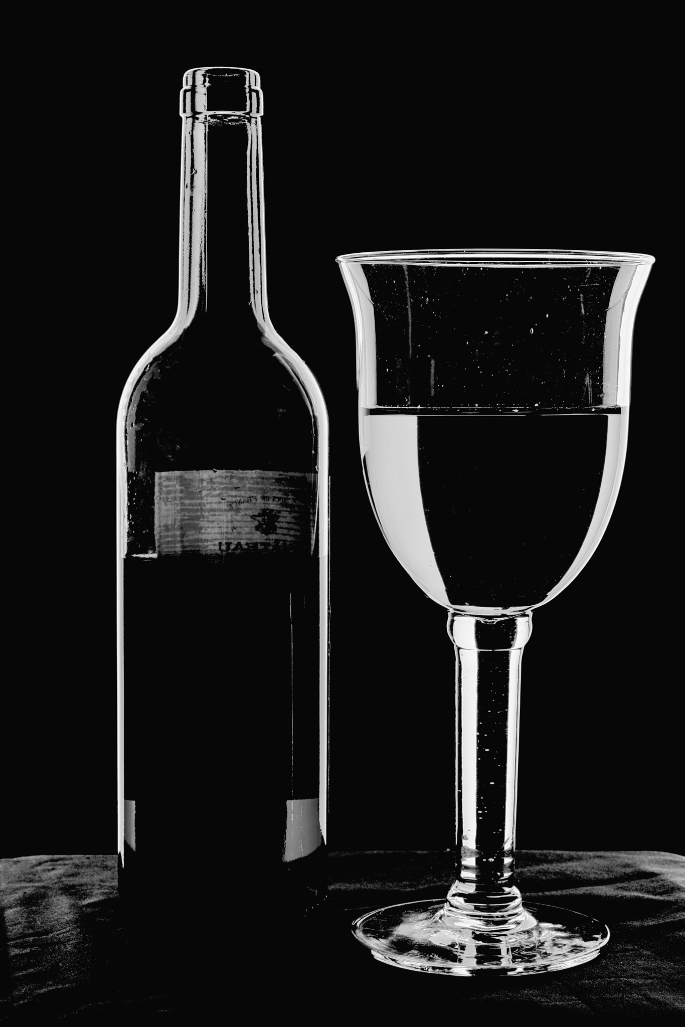 Minolta AF 28-75mm F2.8 (D) sample photo. Bottle and glass - high key monochrome. photography