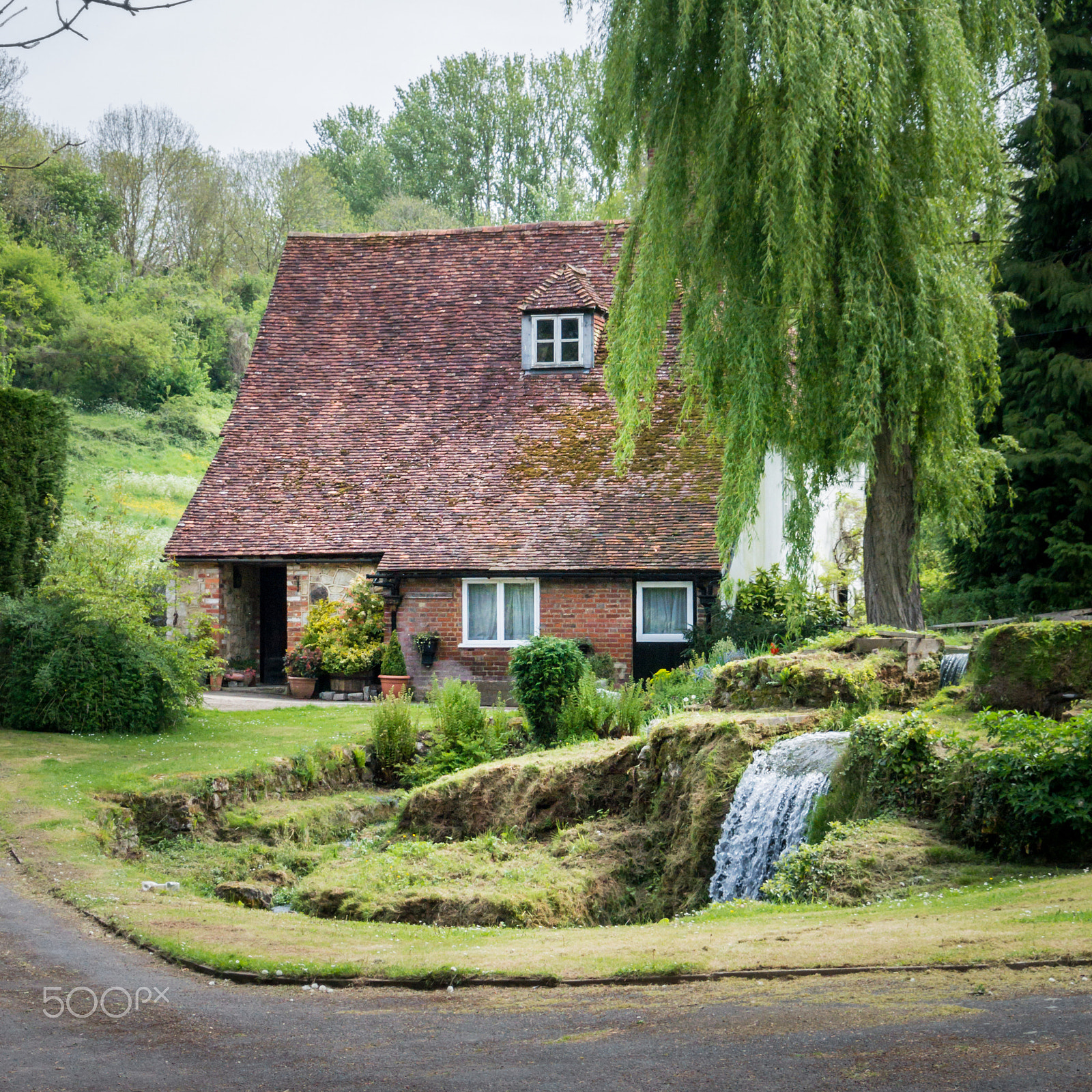 Nikon 1 V2 sample photo. Cottage, garden and stream photography
