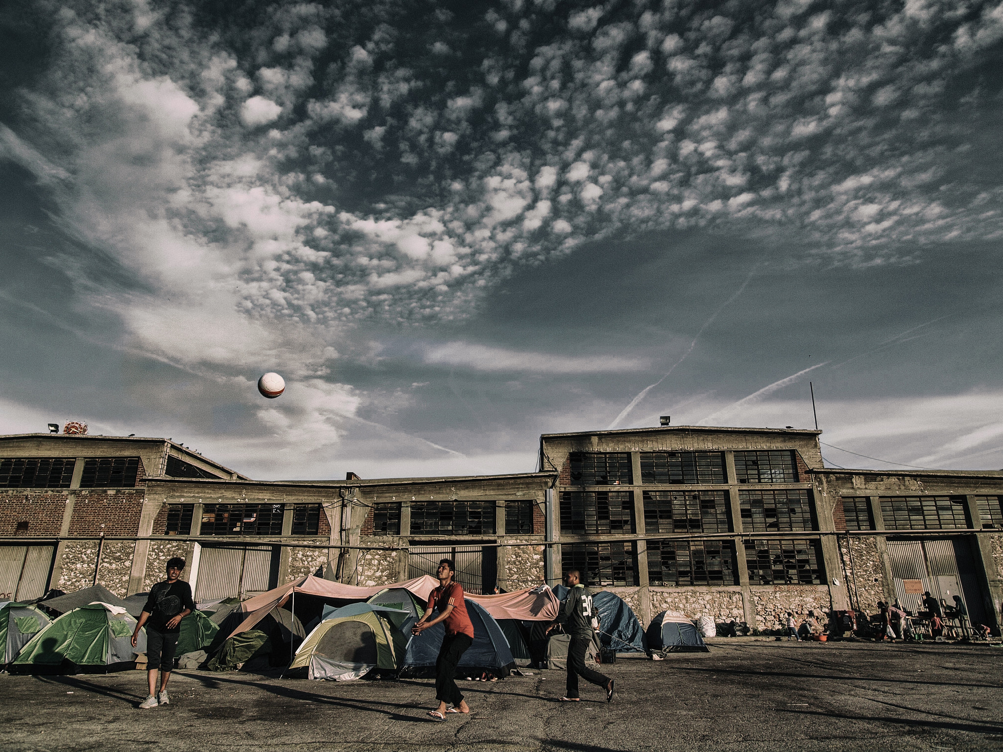 OLYMPUS 11-22mm Lens sample photo. Ballgame in tent city photography