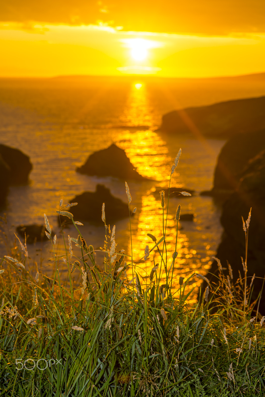 Nikon D610 + Sigma 70-300mm F4-5.6 APO DG Macro sample photo. Beautiful sunset over the coastal rocks photography