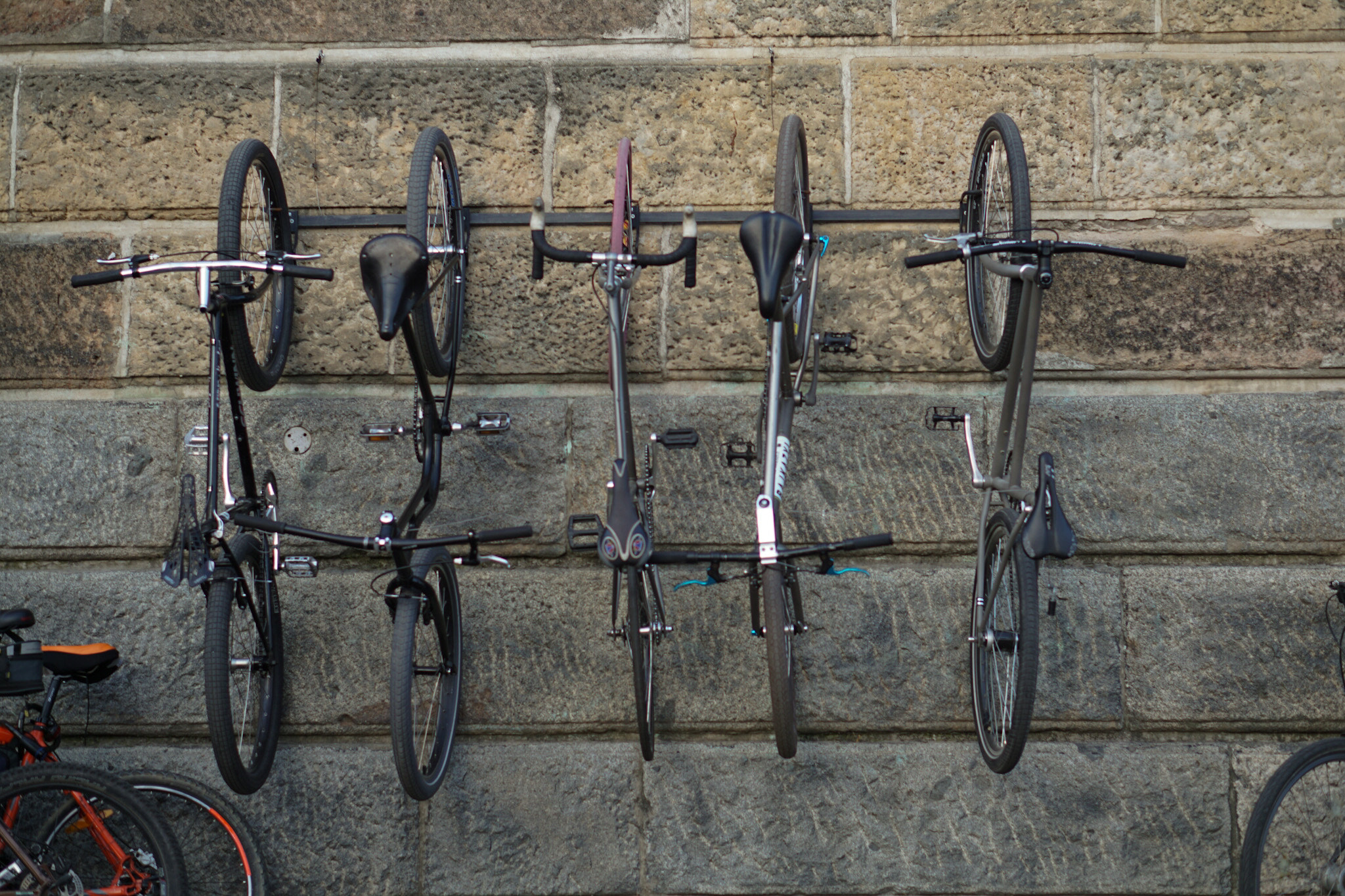 Sony a5100 + E 50mm F1.8 OSS sample photo. Bicycles on the wall photography