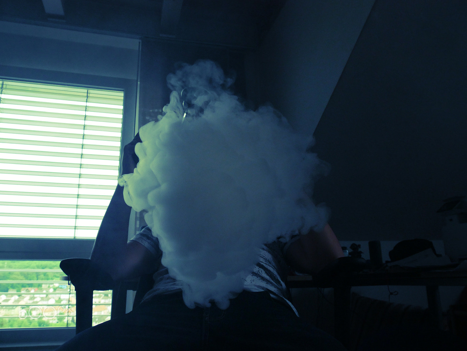 Panasonic DMC-G70 sample photo. Hiding behind smoke and noise photography