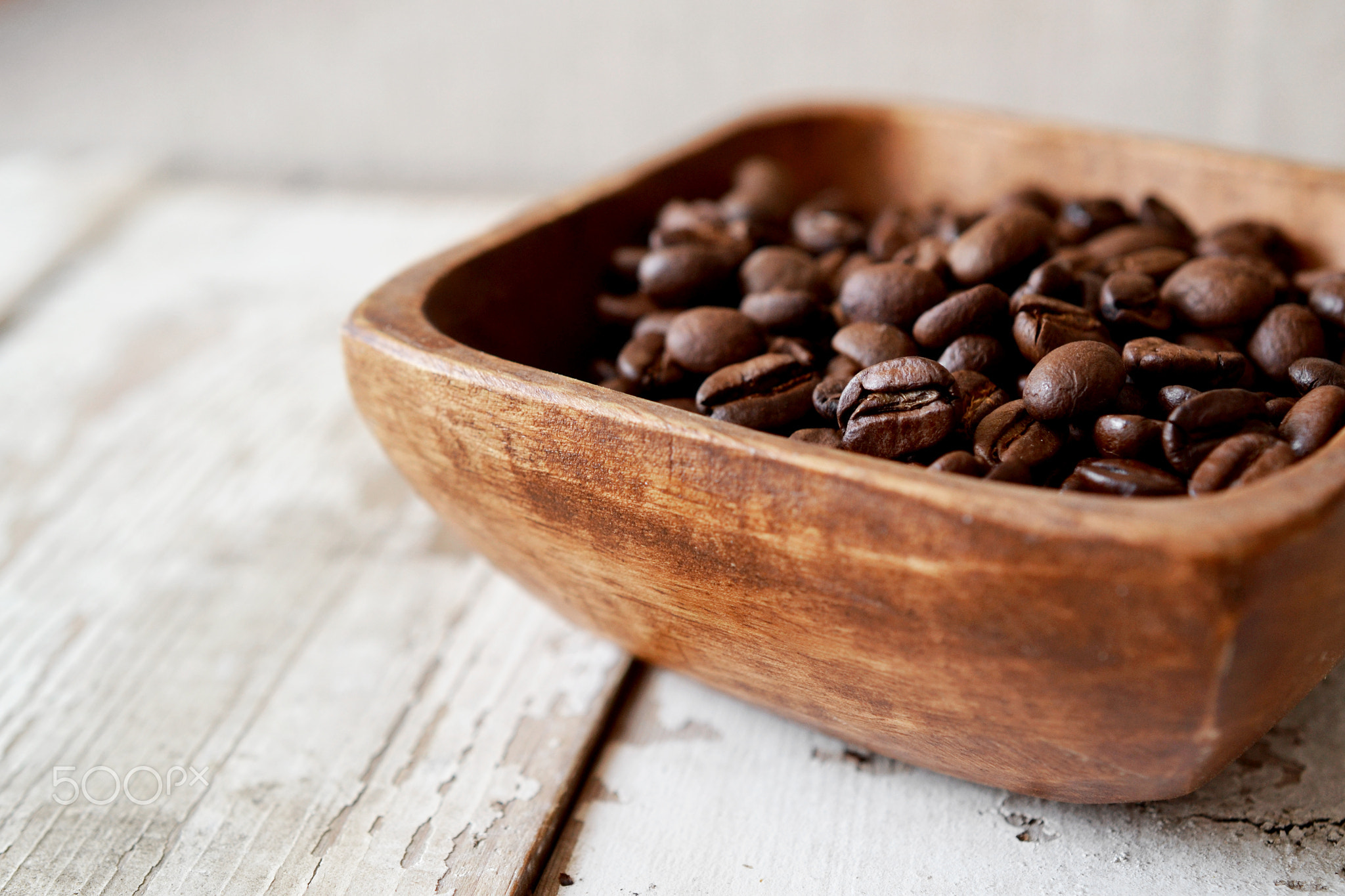 coffee beans in wood bowl