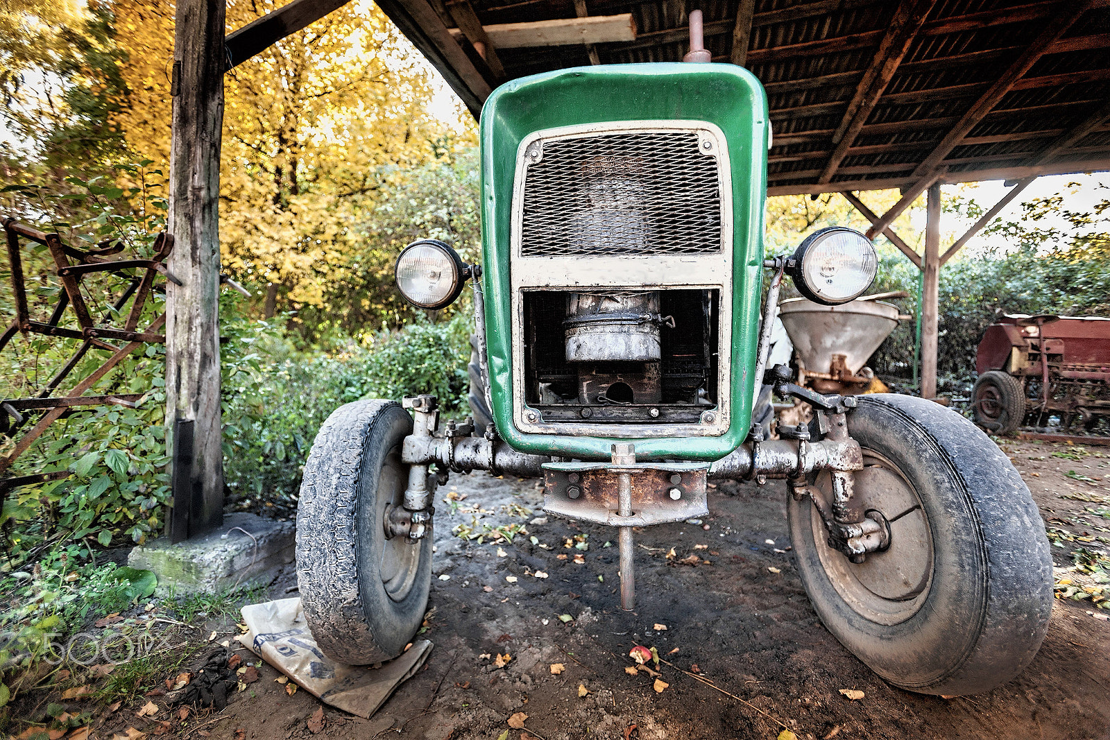 Canon EOS 5D + Canon EF 16-35mm F2.8L USM sample photo. Ancient, used tractor photography