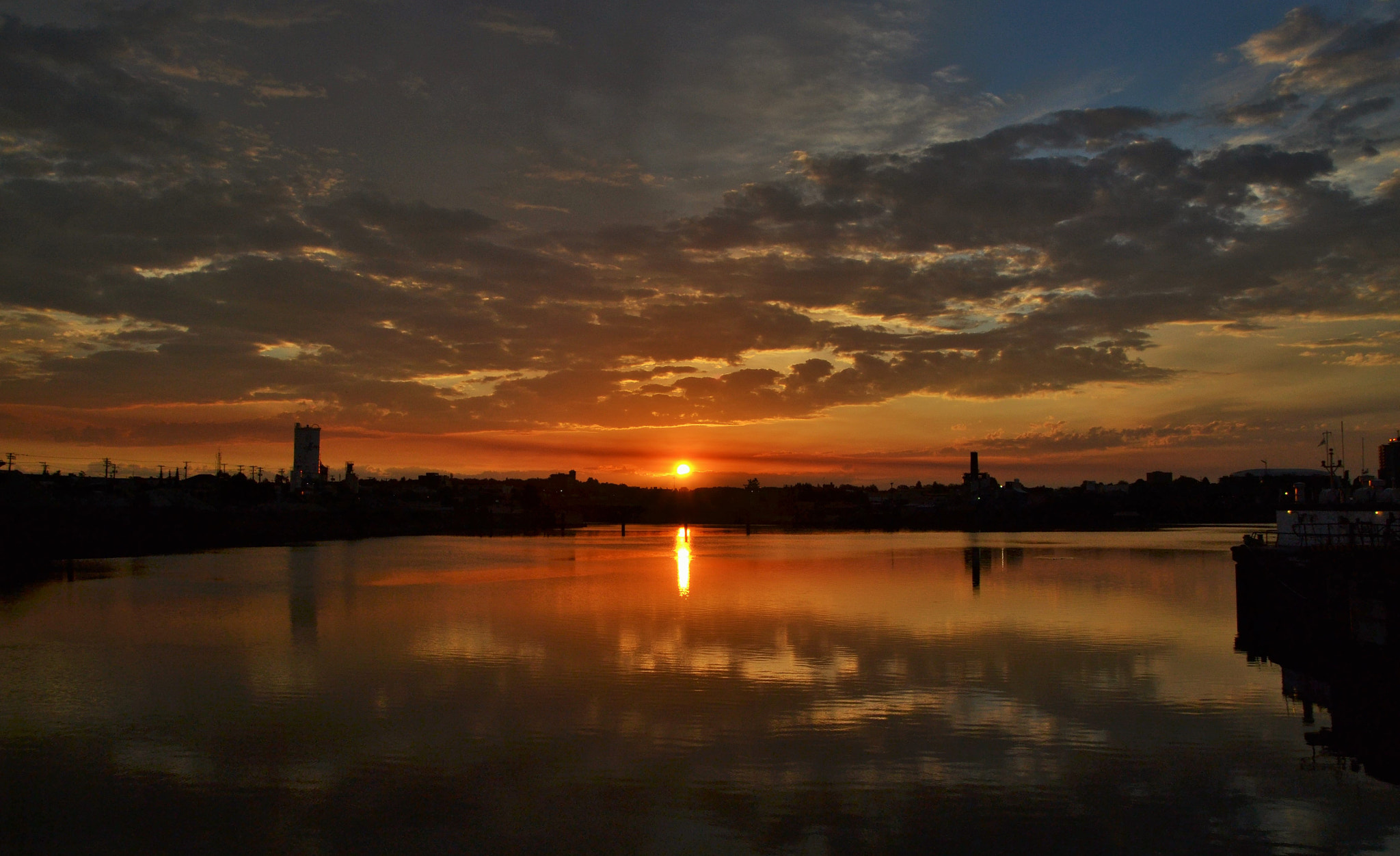 Nikon D3100 + Sigma 17-70mm F2.8-4 DC Macro OS HSM sample photo. Sunrise beautifying industrial city landscape.. photography