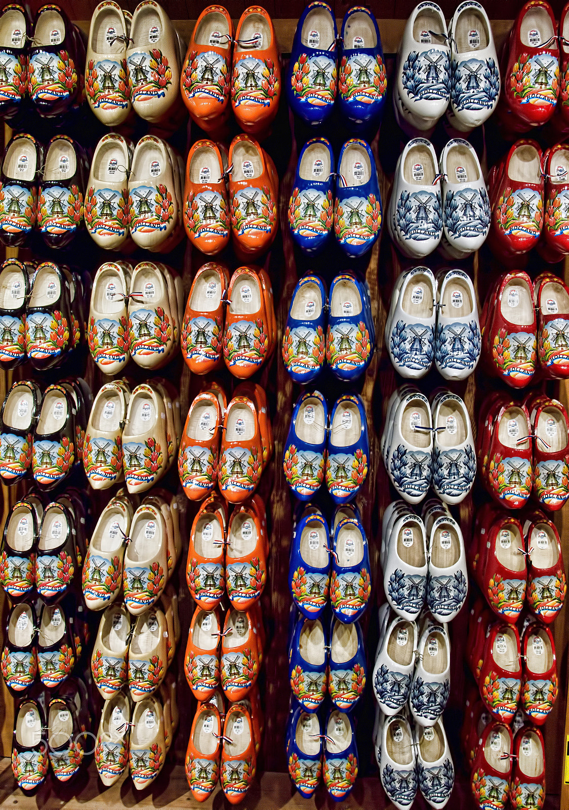 Sony SLT-A77 + Tamron 18-270mm F3.5-6.3 Di II PZD sample photo. A rack of brightly painted clogs. photography