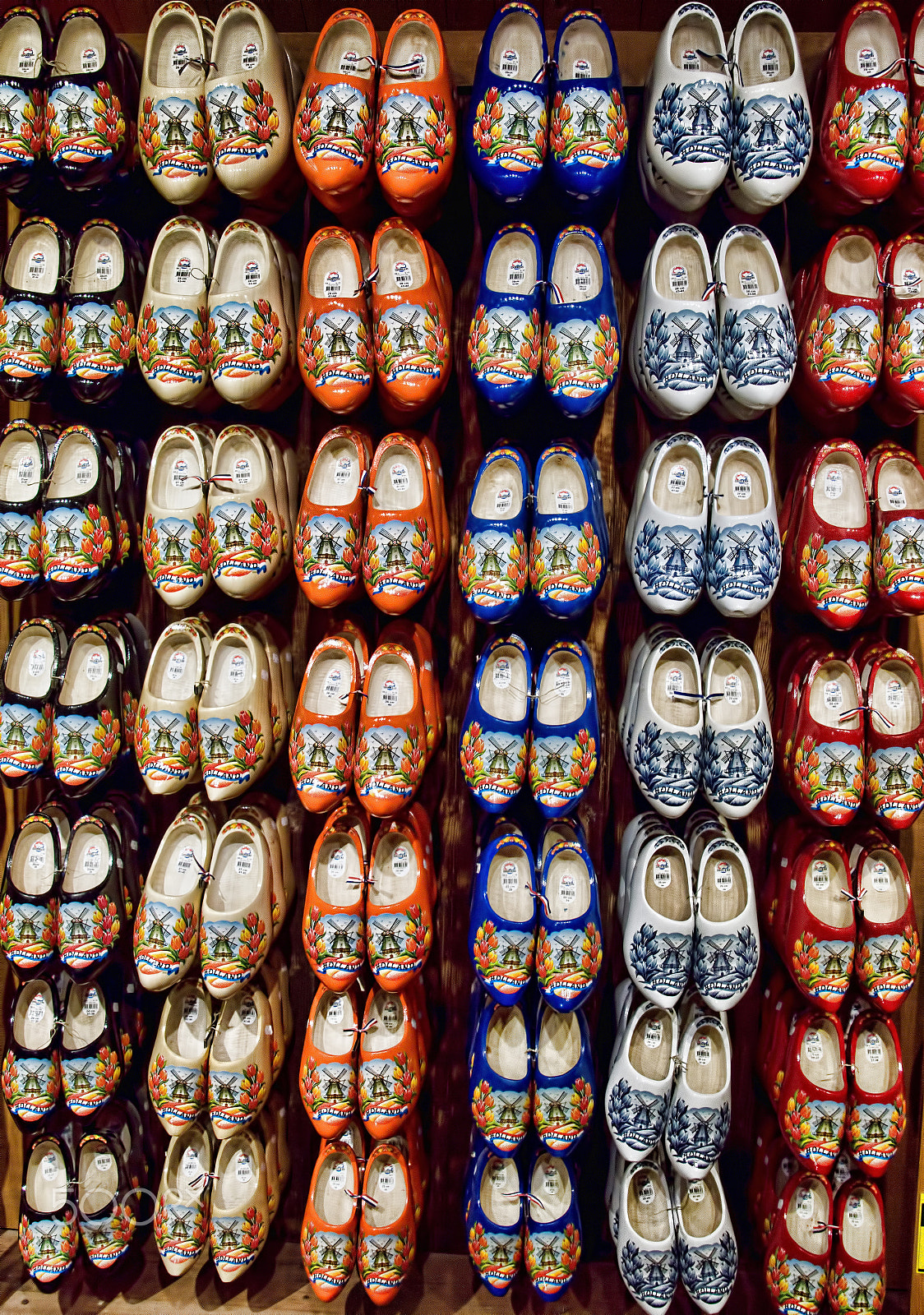 Tamron 18-270mm F3.5-6.3 Di II PZD sample photo. A rack of brightly painted clogs. photography