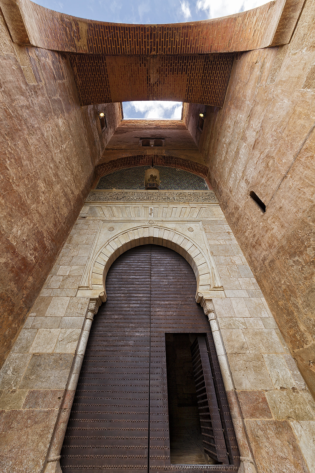 Canon EOS 5D Mark II + Sigma 12-24mm F4.5-5.6 II DG HSM sample photo. The justice door in the alhambra photography