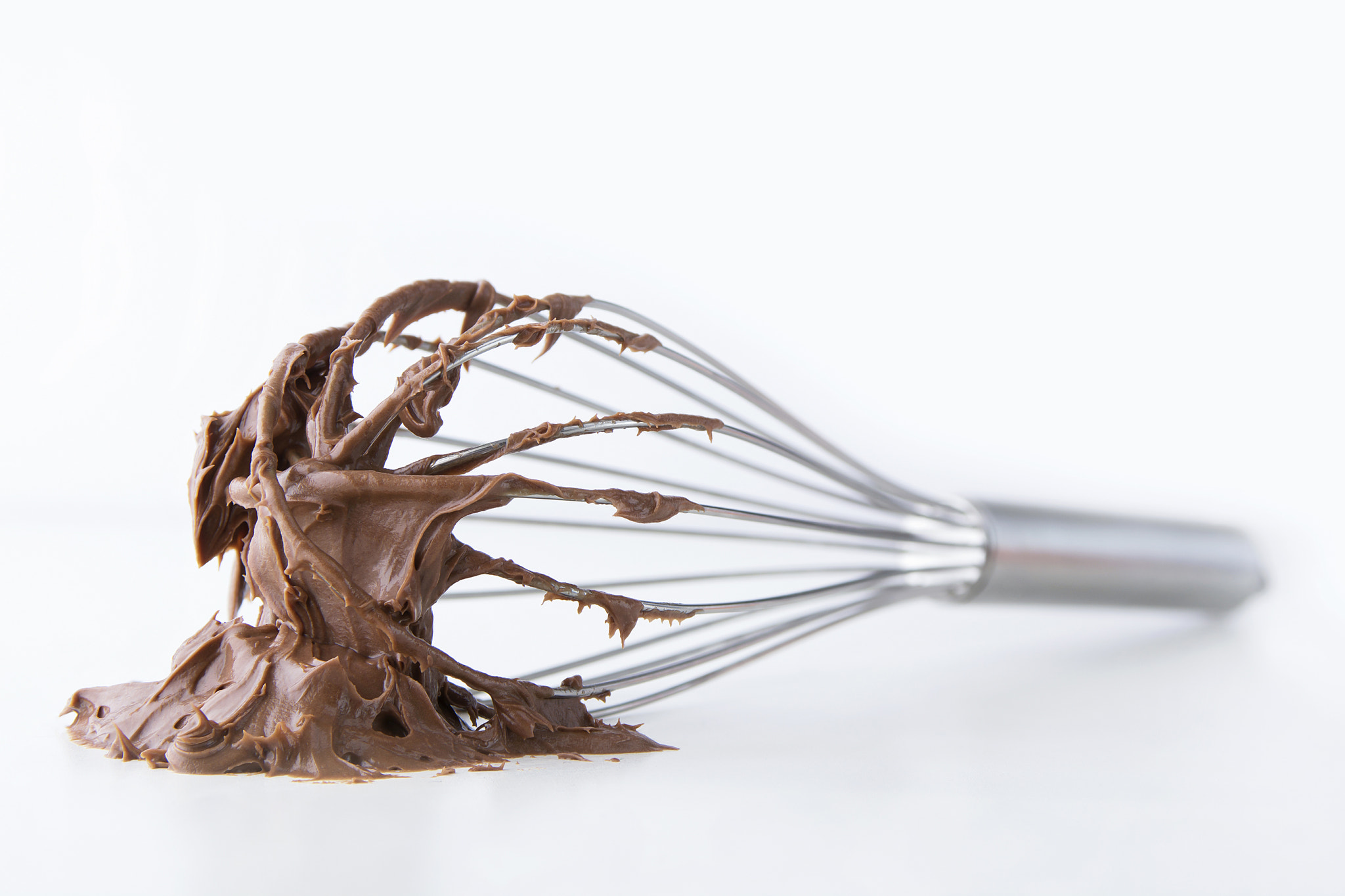 Nikon D7100 + Nikon AF-S Nikkor 28-70mm F2.8 ED-IF sample photo. Wire whisk with chocolate and white background photography