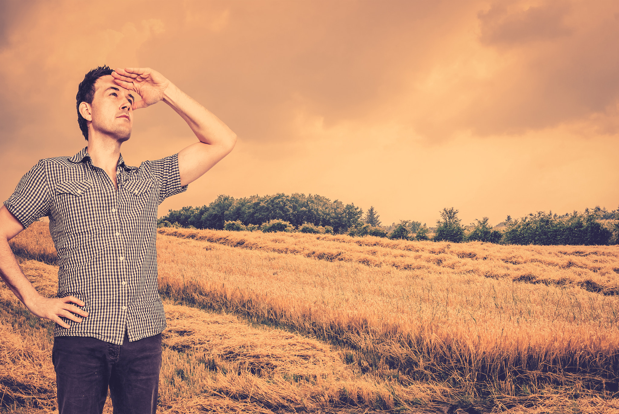 Sony 50mm F1.4 sample photo. Man scouting on a countryside field photography