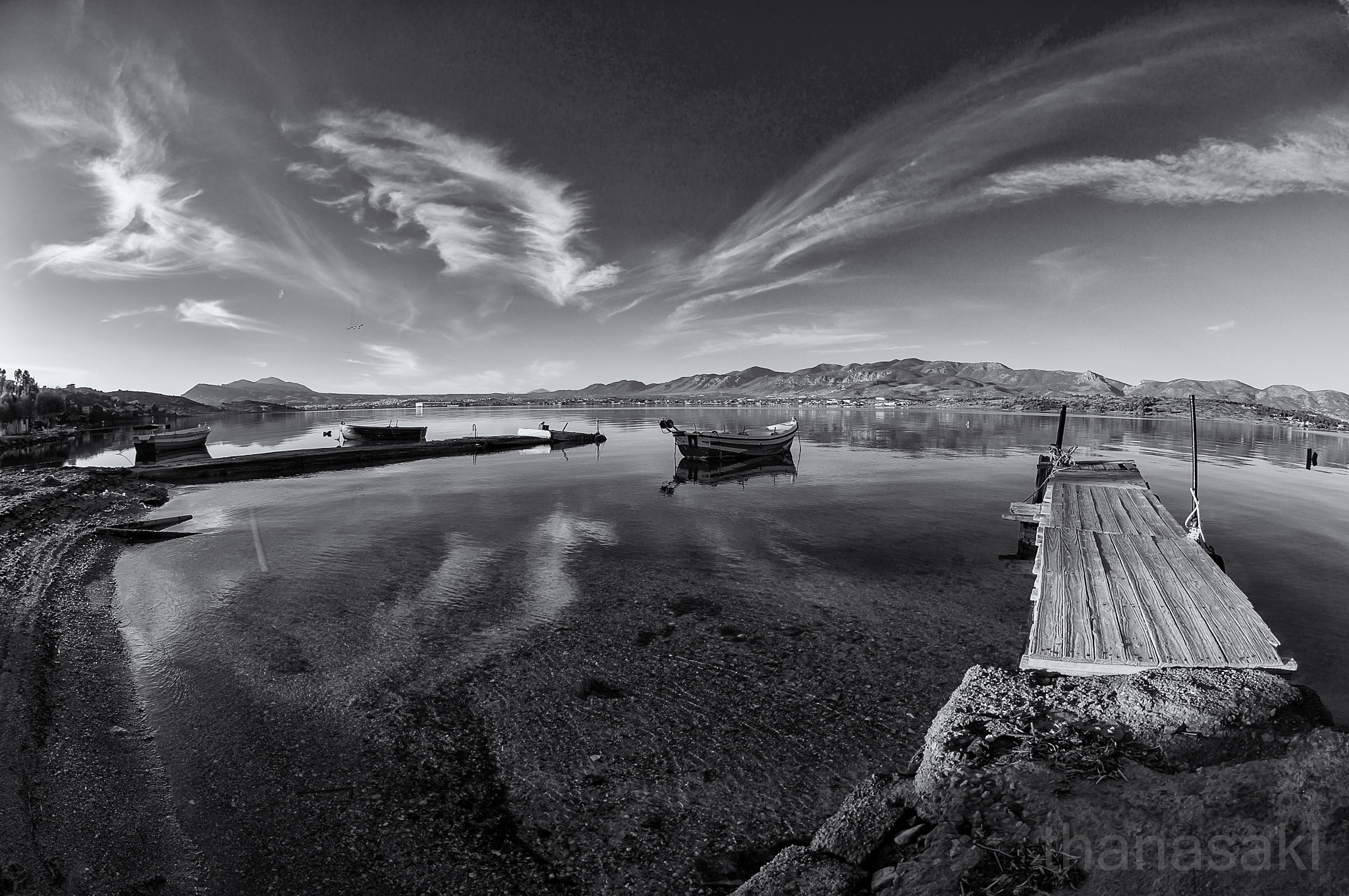 Nikon AF DX Fisheye-Nikkor 10.5mm F2.8G ED sample photo. Pier and clouds photography