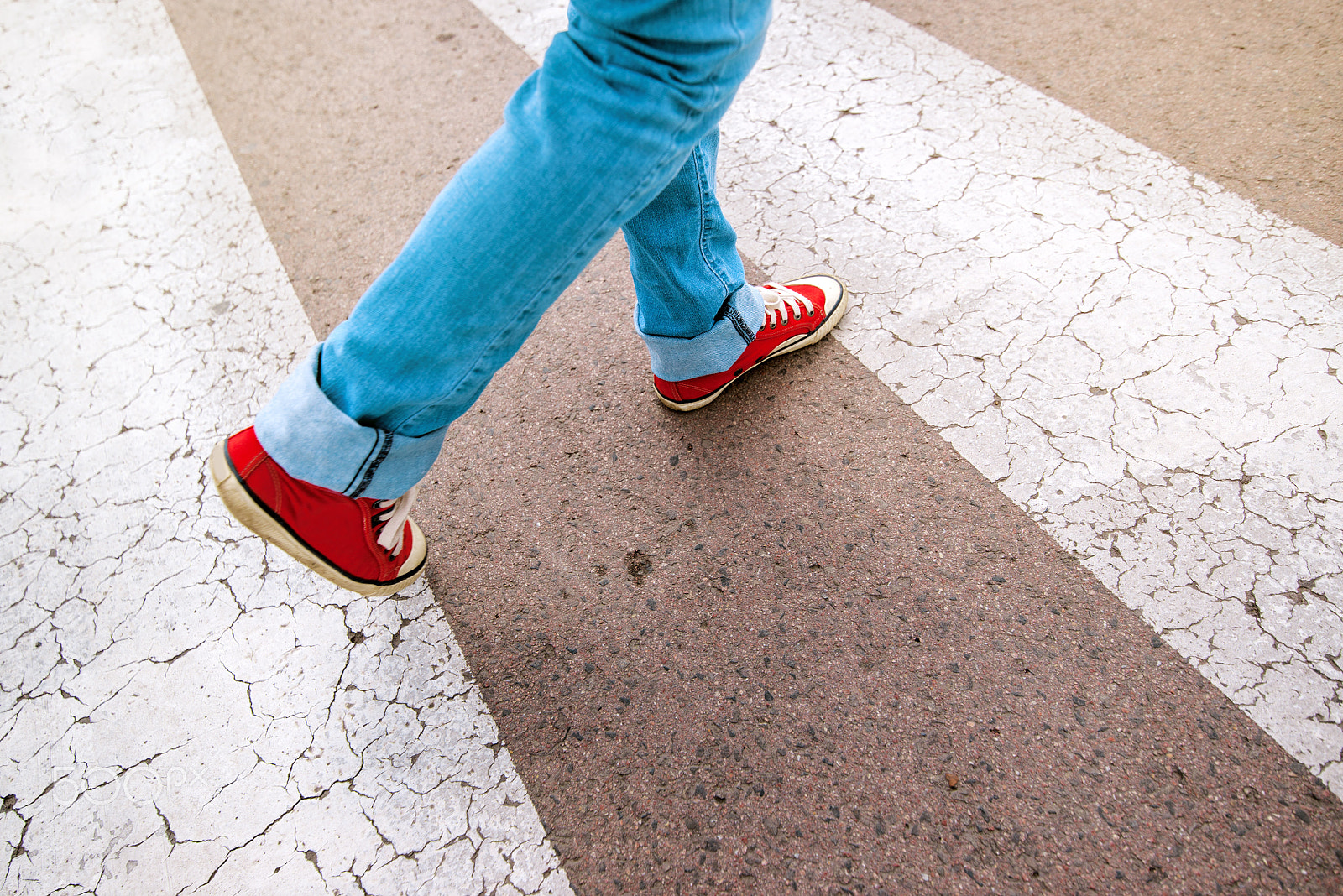 Tamron SP 15-30mm F2.8 Di VC USD sample photo. Young teenage person walking over pedestrian zebra crosswalk photography