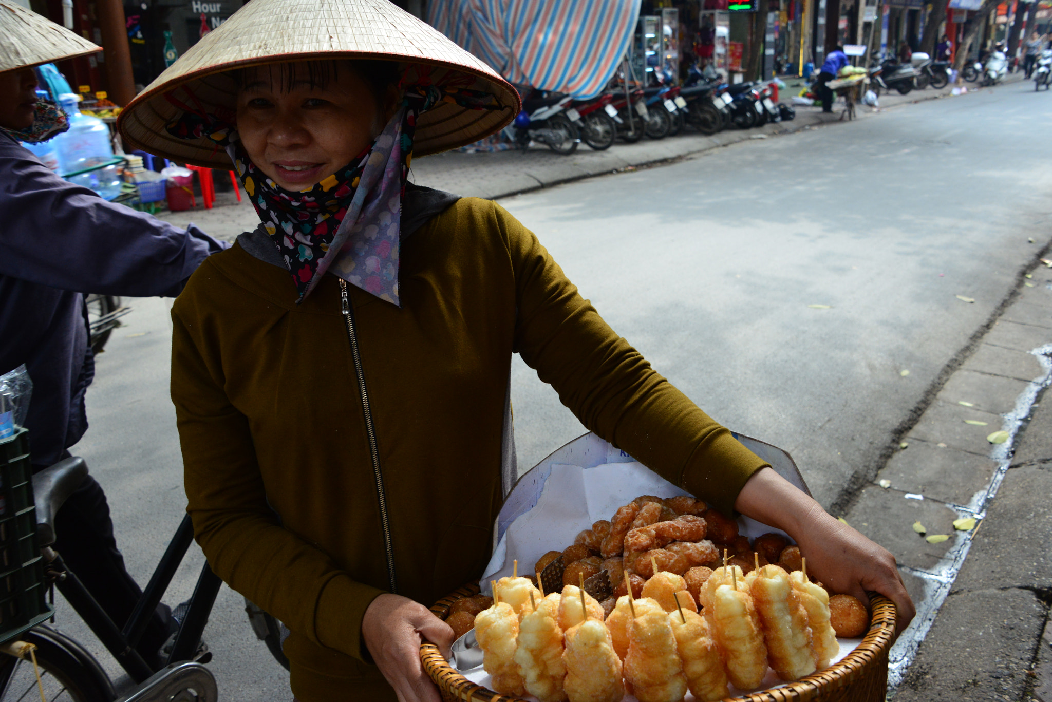 selling sweets in the street, Hanoi