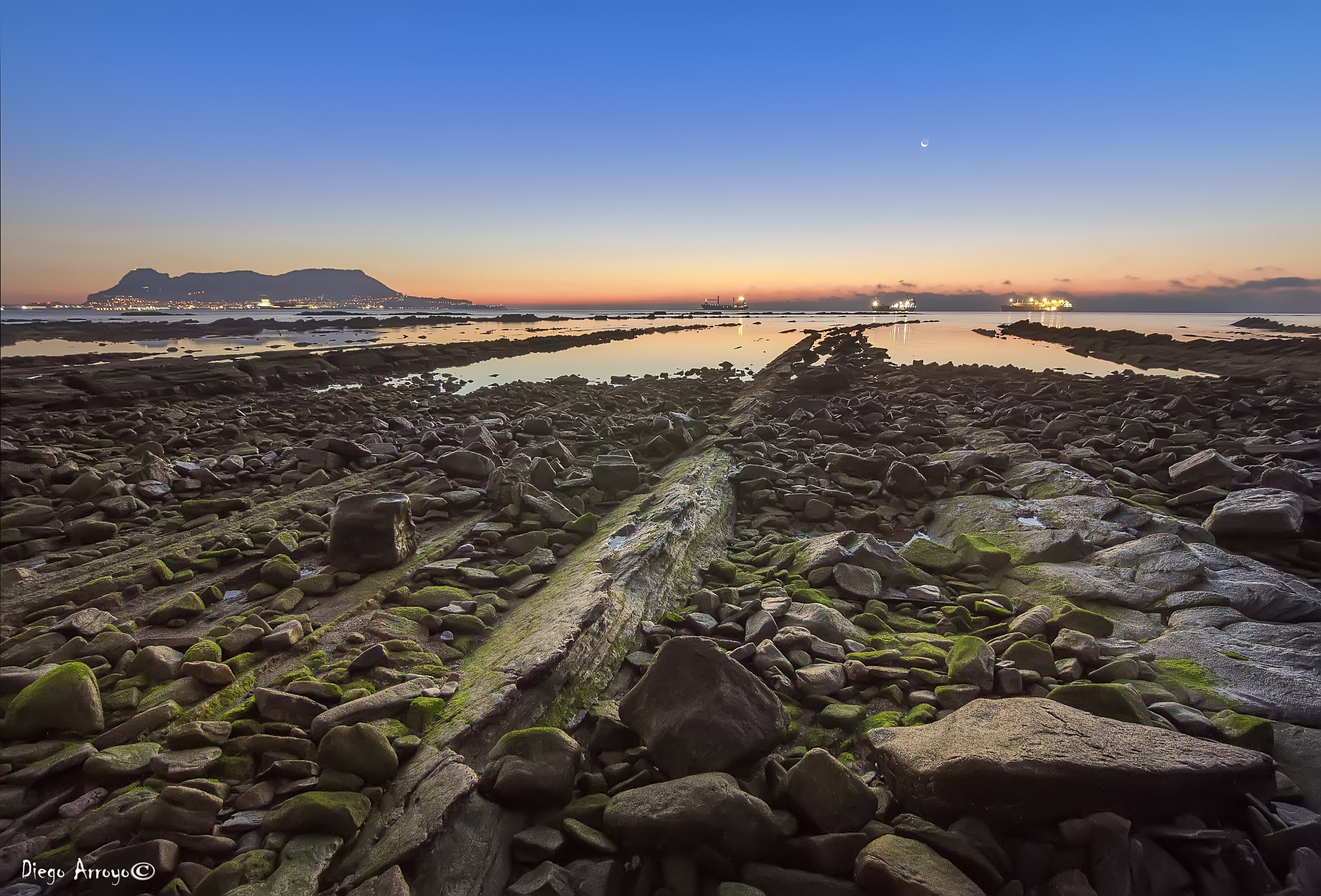 Sony SLT-A37 sample photo. A sunrise between rocks photography