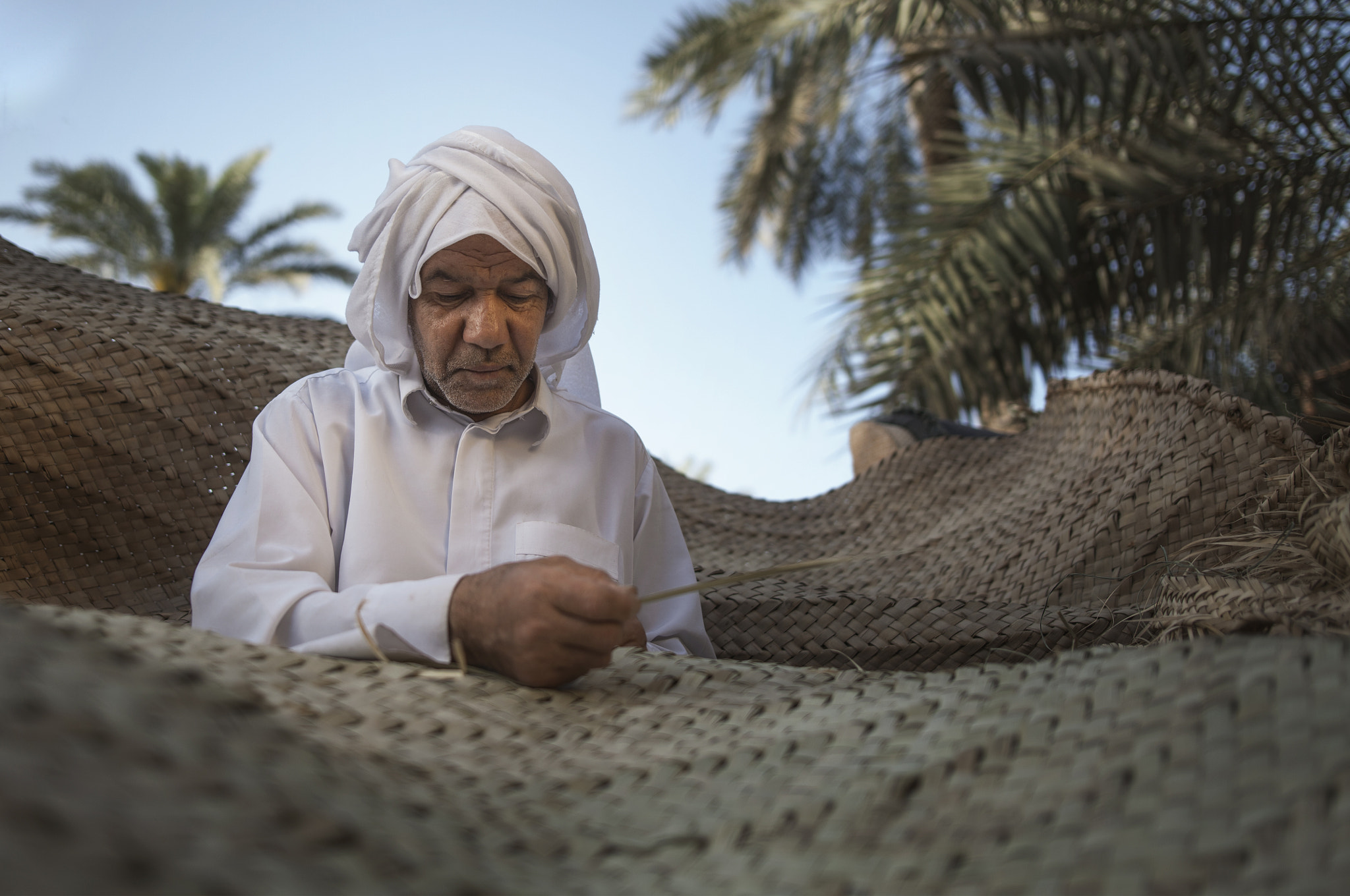 Sigma 24-35mm F2 DG HSM Art sample photo. This man is very interesting in his job, he is doing this job since he was a child. photography