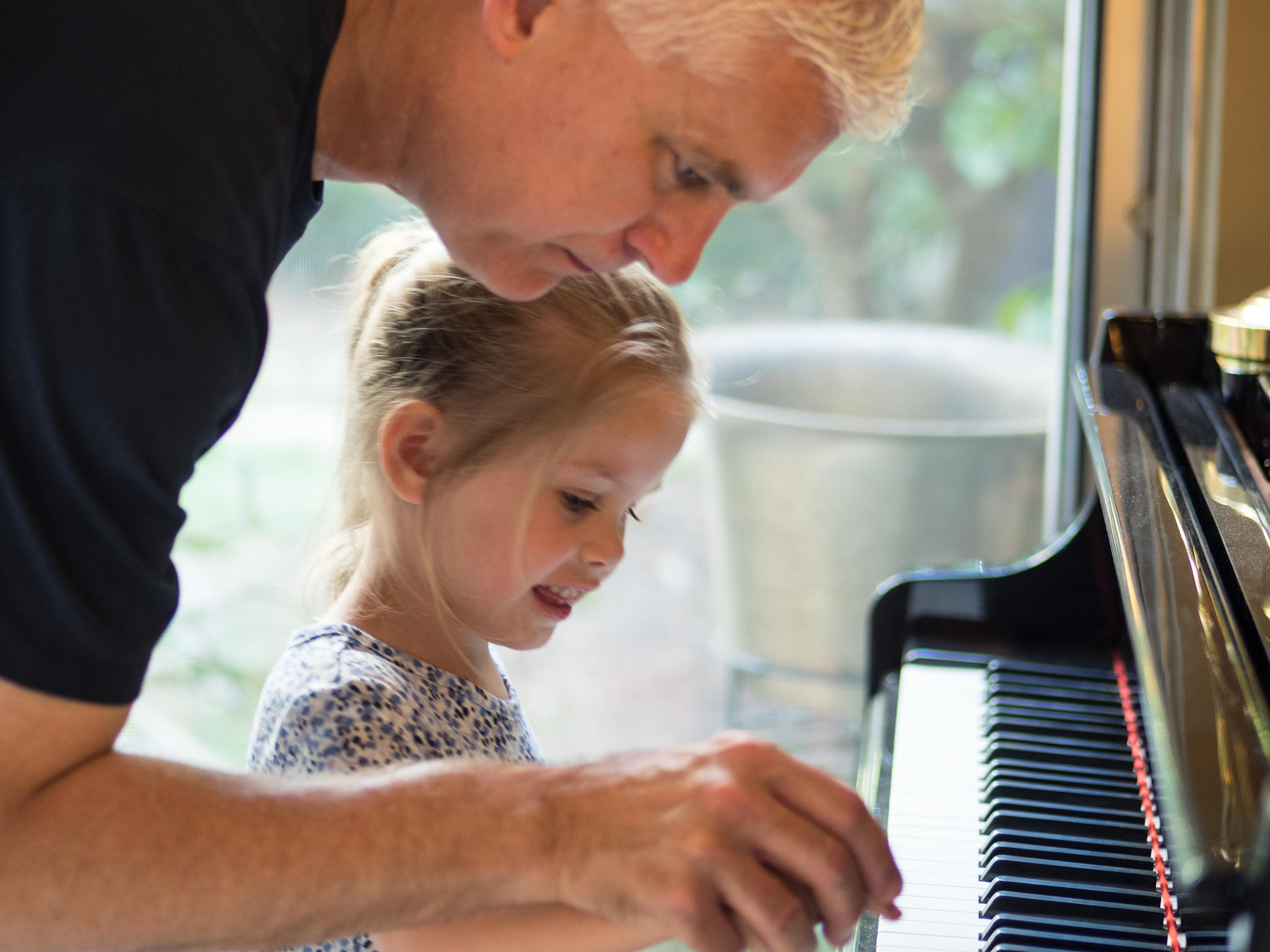Panasonic Lumix G 42.5mm F1.7 ASPH Power OIS sample photo. John with young student photography