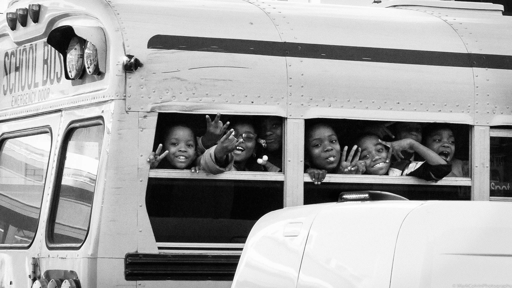 Sony a5100 + Sony E 35mm F1.8 OSS sample photo. These precious lives matter (kids on the bus) photography