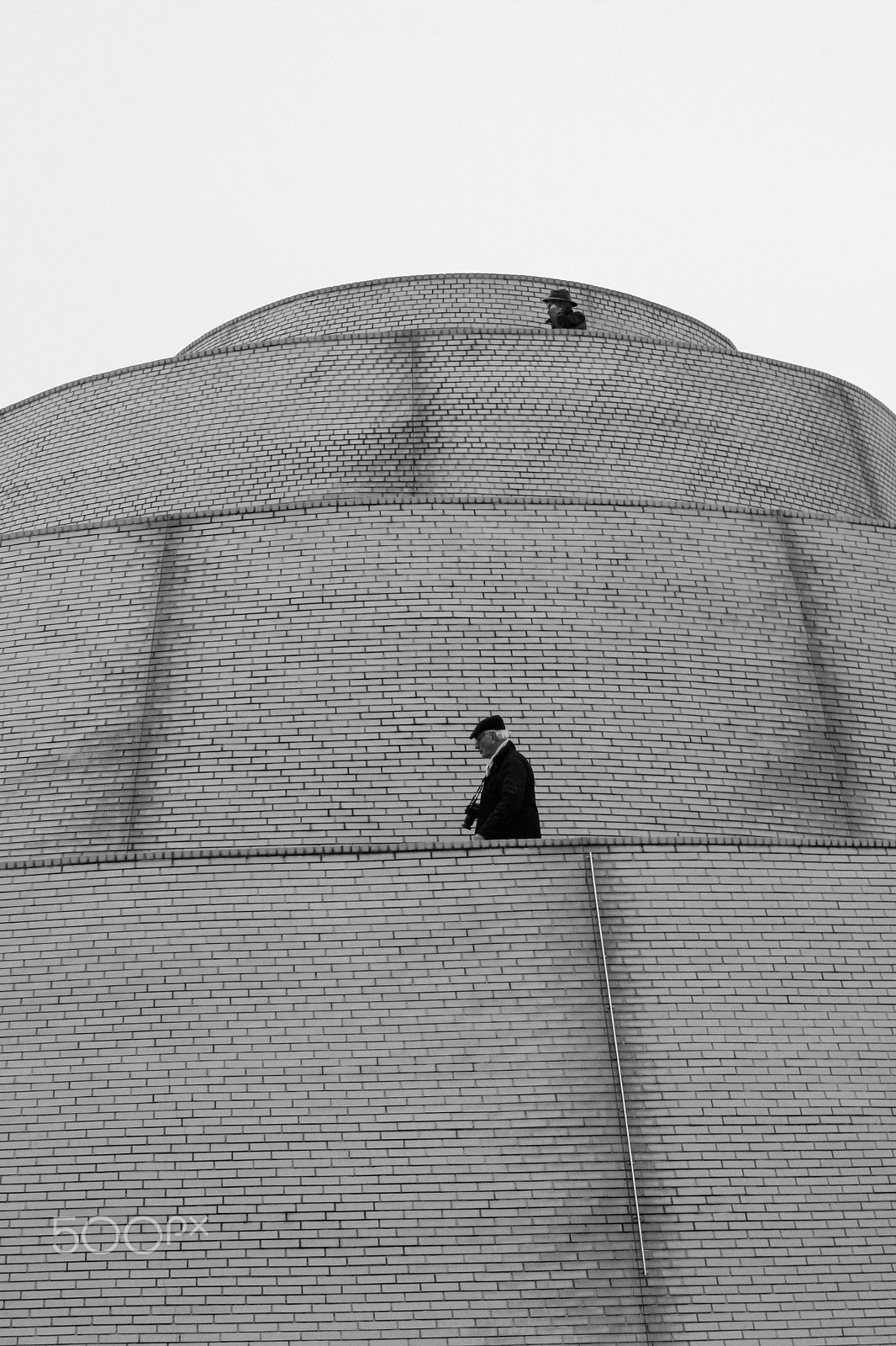 Canon EF 50mm f/1.8 sample photo. Two men and the architecture photography