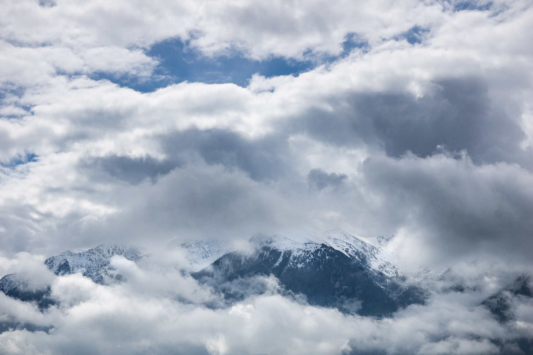 Panasonic Lumix G X Vario 12-35mm F2.8 ASPH Power OIS sample photo. A storm is brewing over the mountains photography