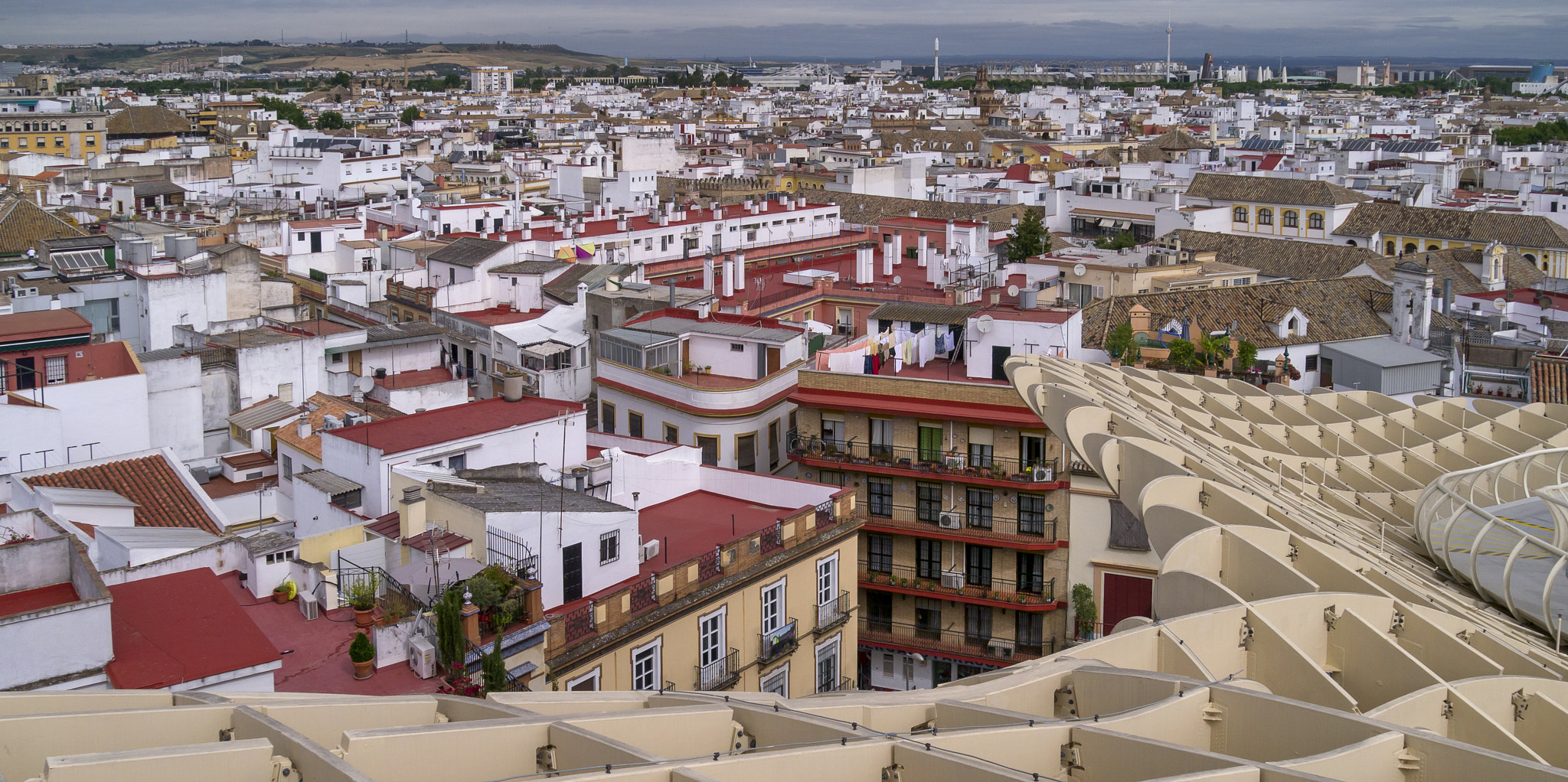 Panasonic Lumix DMC-GX1 + Panasonic Lumix G Vario HD 14-140mm F4-5.8 OIS sample photo. Seville rooftops photography