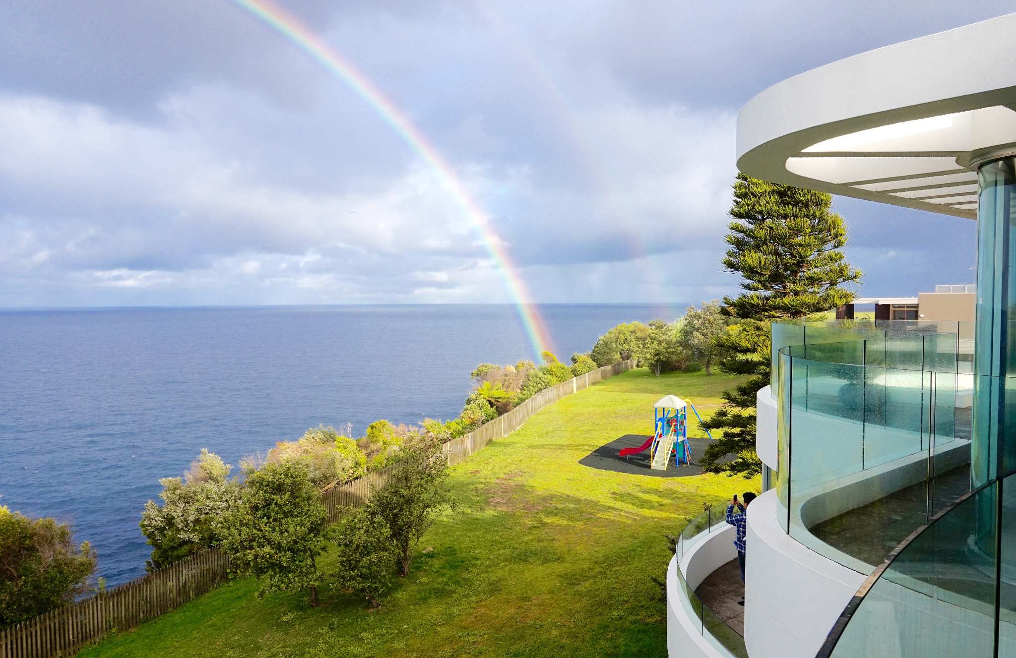 Sony Alpha QX1 + Sony E 18-50mm F4-5.6 sample photo. Double rainbows over the sea in front of my house photography