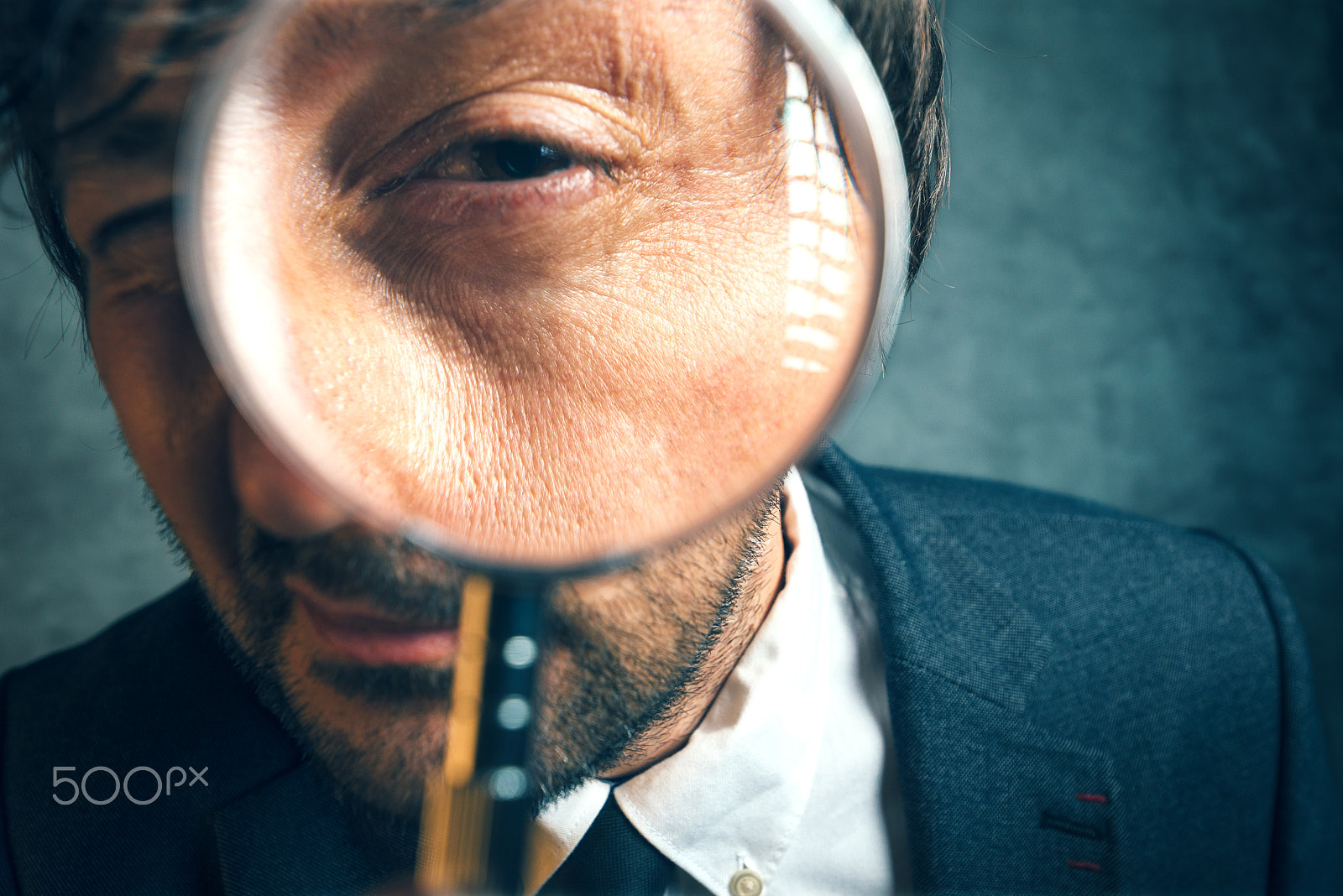 Tamron SP 15-30mm F2.8 Di VC USD sample photo. Enlarged eye of tax inspector looking through magnifying glass photography