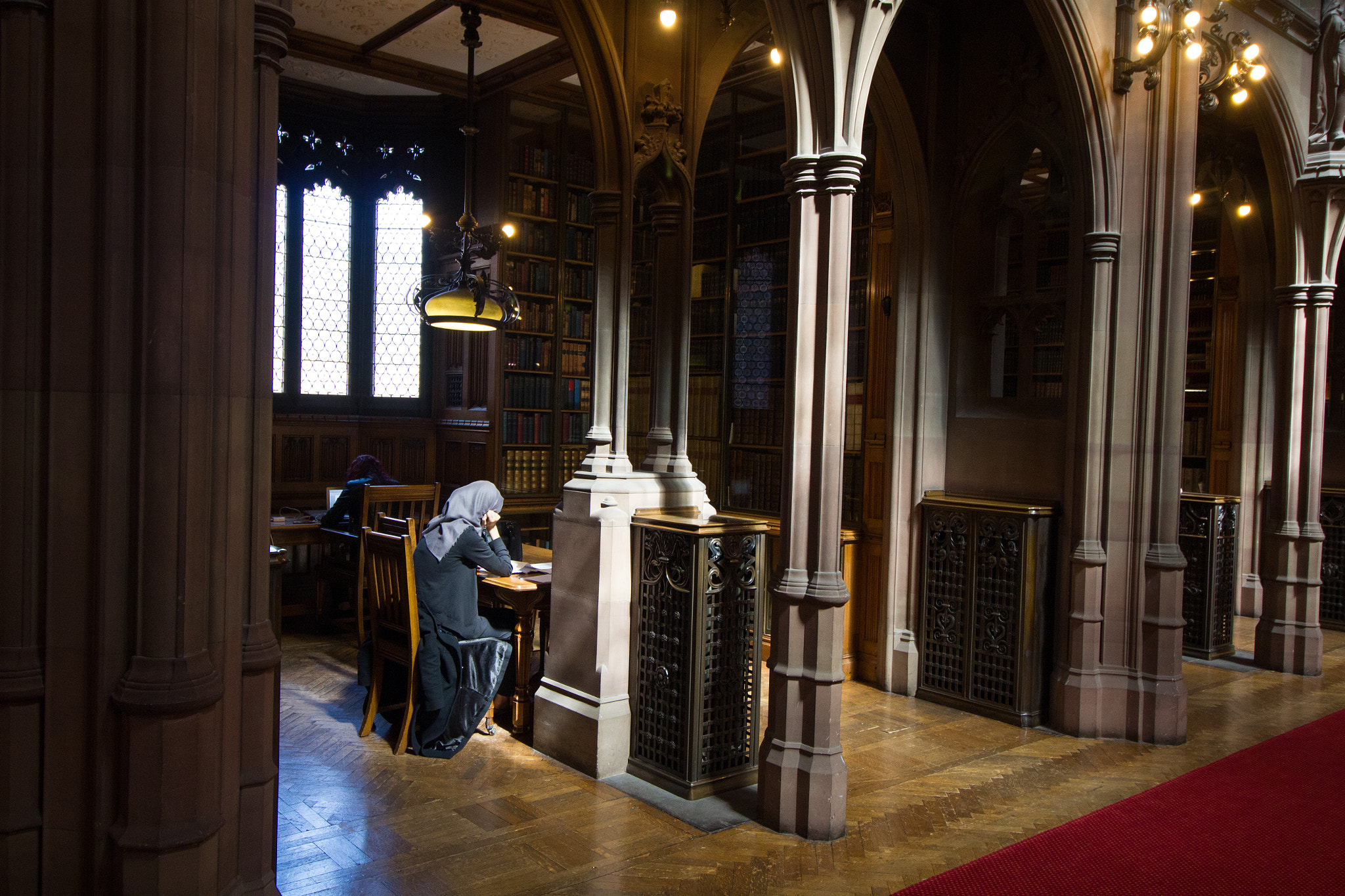 Canon EF-S 10-18mm F4.5–5.6 IS STM sample photo. A woman reading at the library photography
