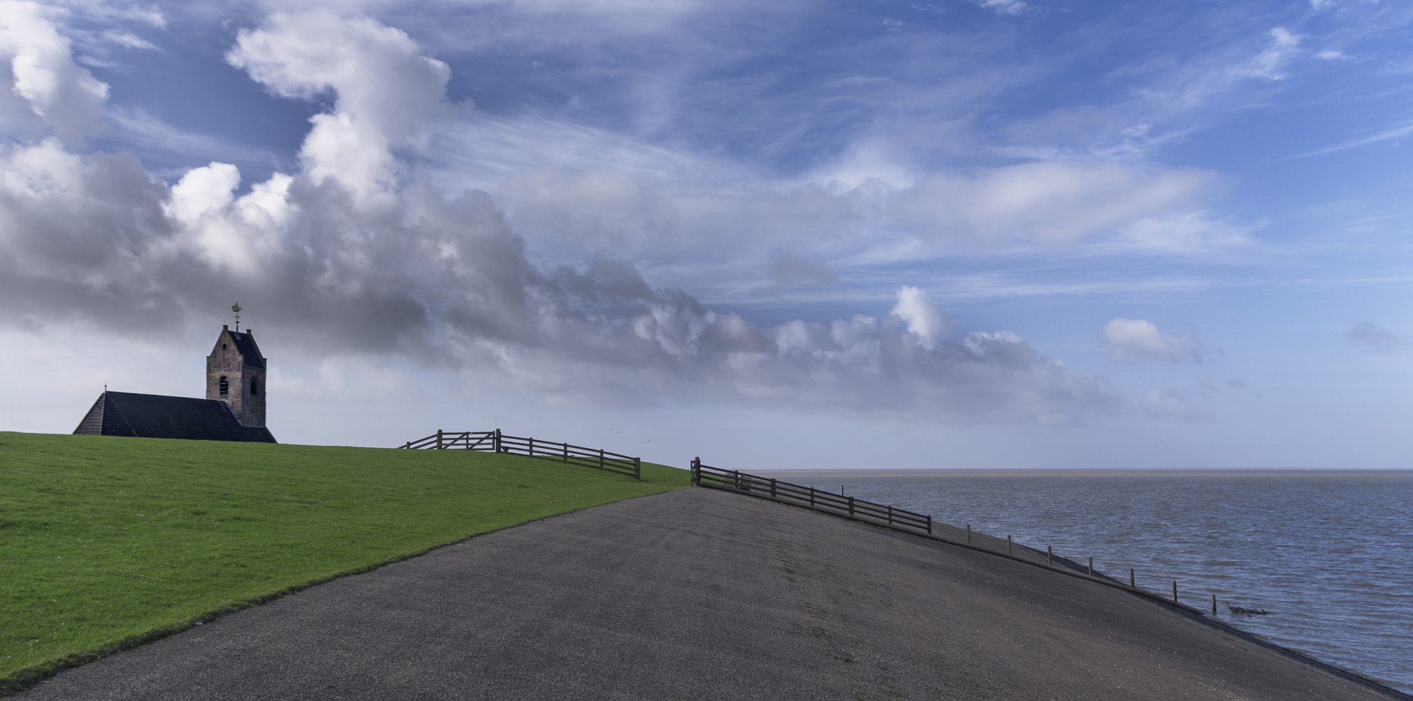 Pentax smc DA 18-55mm F3.5-5.6 AL sample photo. Church from wierum is watching the mudflats... ano ... photography