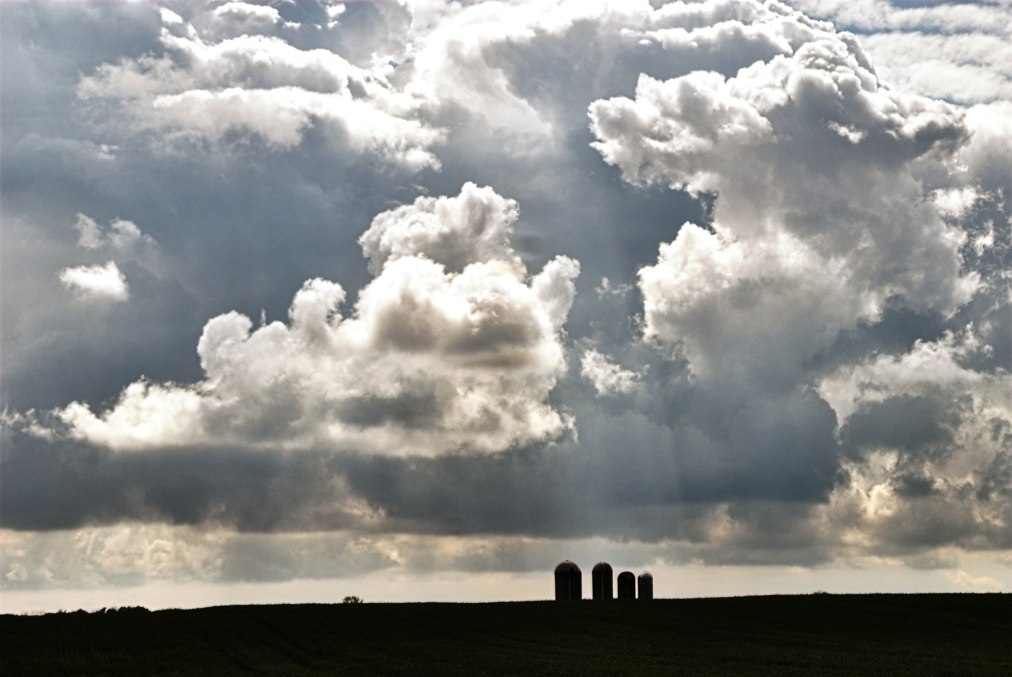 Nikon D200 + AF Zoom-Nikkor 35-70mm f/3.3-4.5 sample photo. Cloudscape over distant grain silos photography