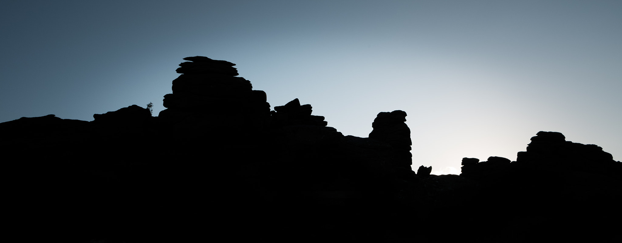 Fujifilm X-M1 + Fujifilm XF 18-55mm F2.8-4 R LM OIS sample photo. Hound tor silhouette photography