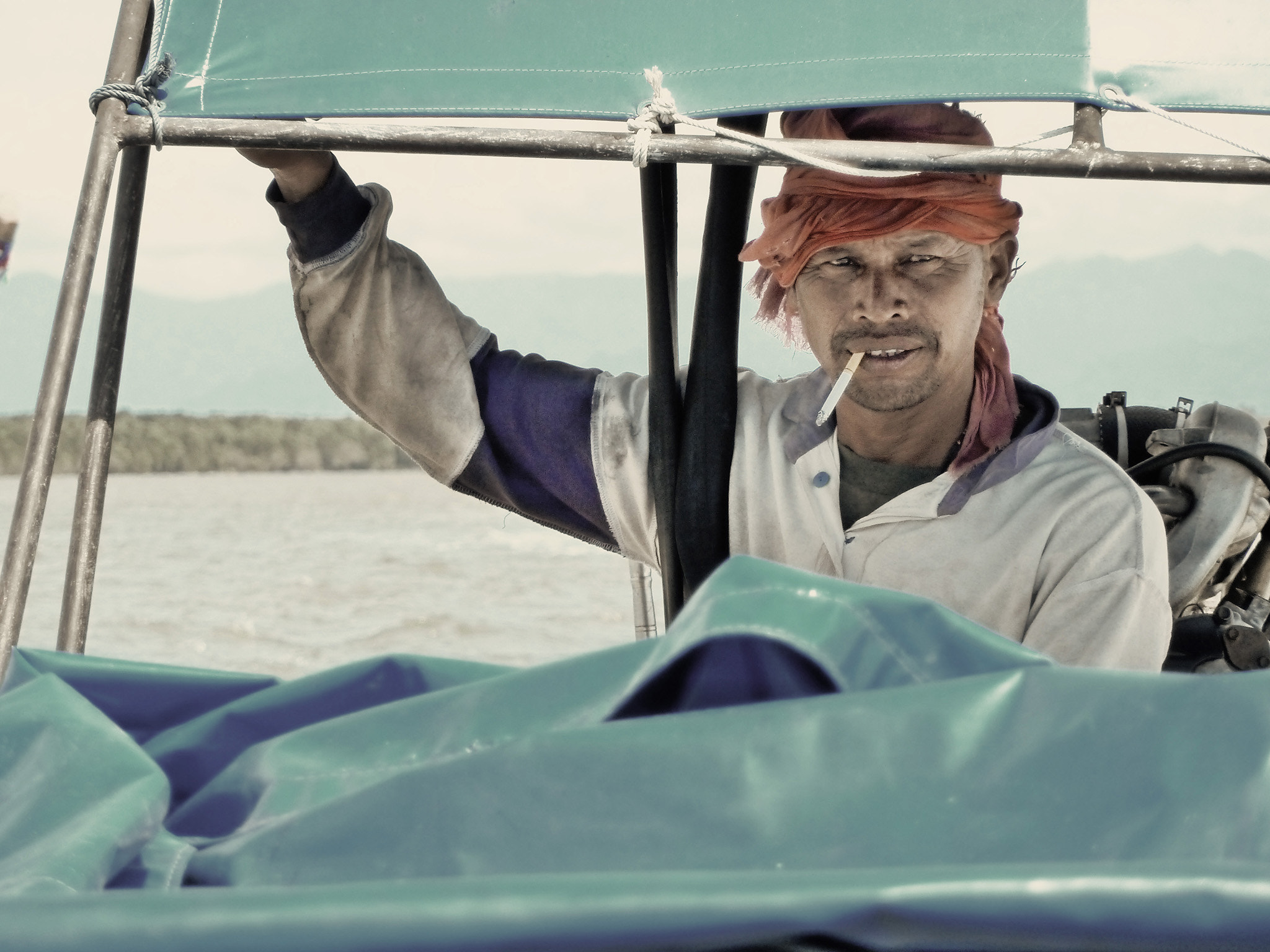 Panasonic Lumix DMC-ZS5 (Lumix DMC-TZ8) sample photo. Our pirate thai boat driver going to koh laoliang photography