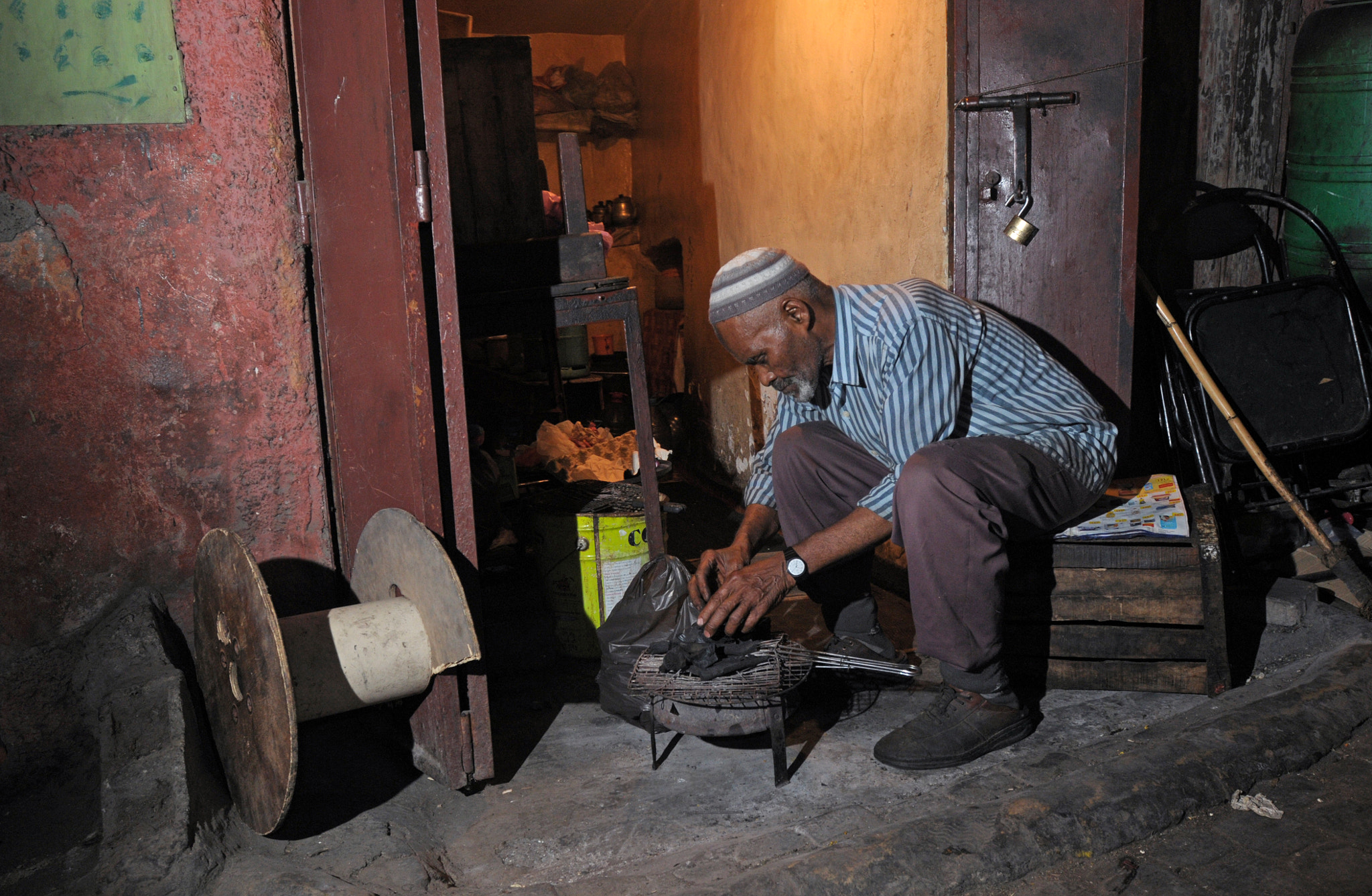 Nikon AF-S Nikkor 17-35mm F2.8D ED-IF sample photo. Man at his workshop photography