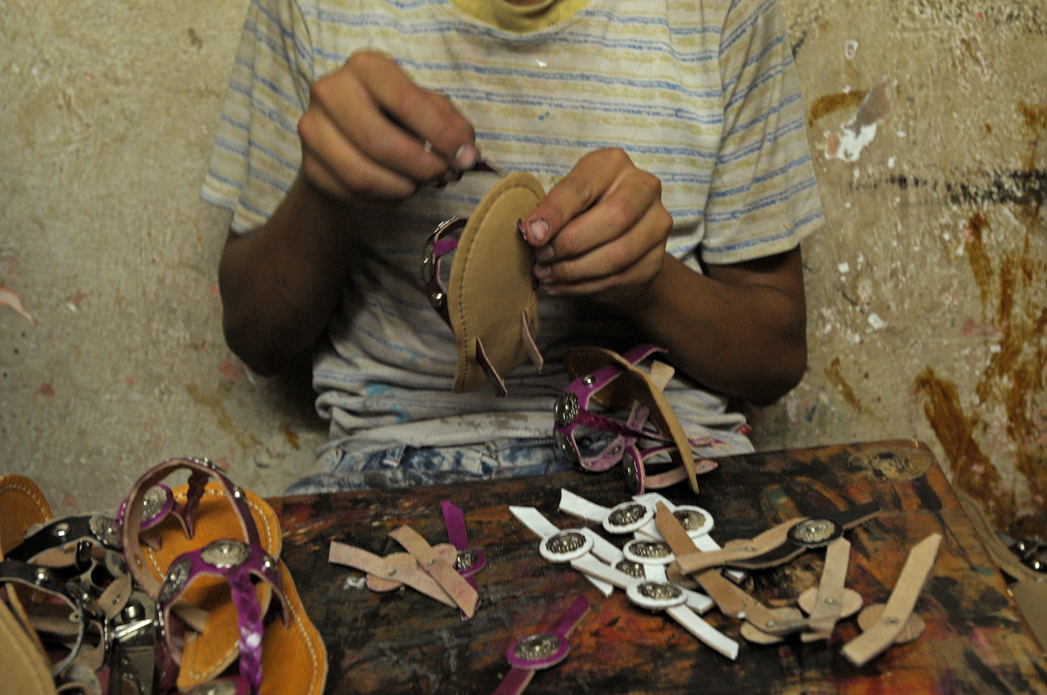 Nikon AF-S Nikkor 17-35mm F2.8D ED-IF sample photo. A boy working at the shoe factory photography