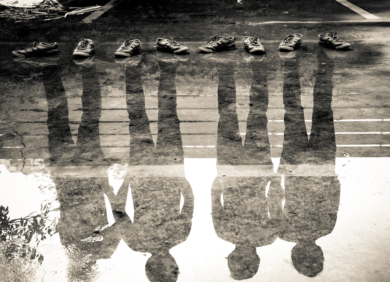 Sigma 17-70mm F2.8-4 DC Macro HSM | C sample photo. Four man reflection in the water photography