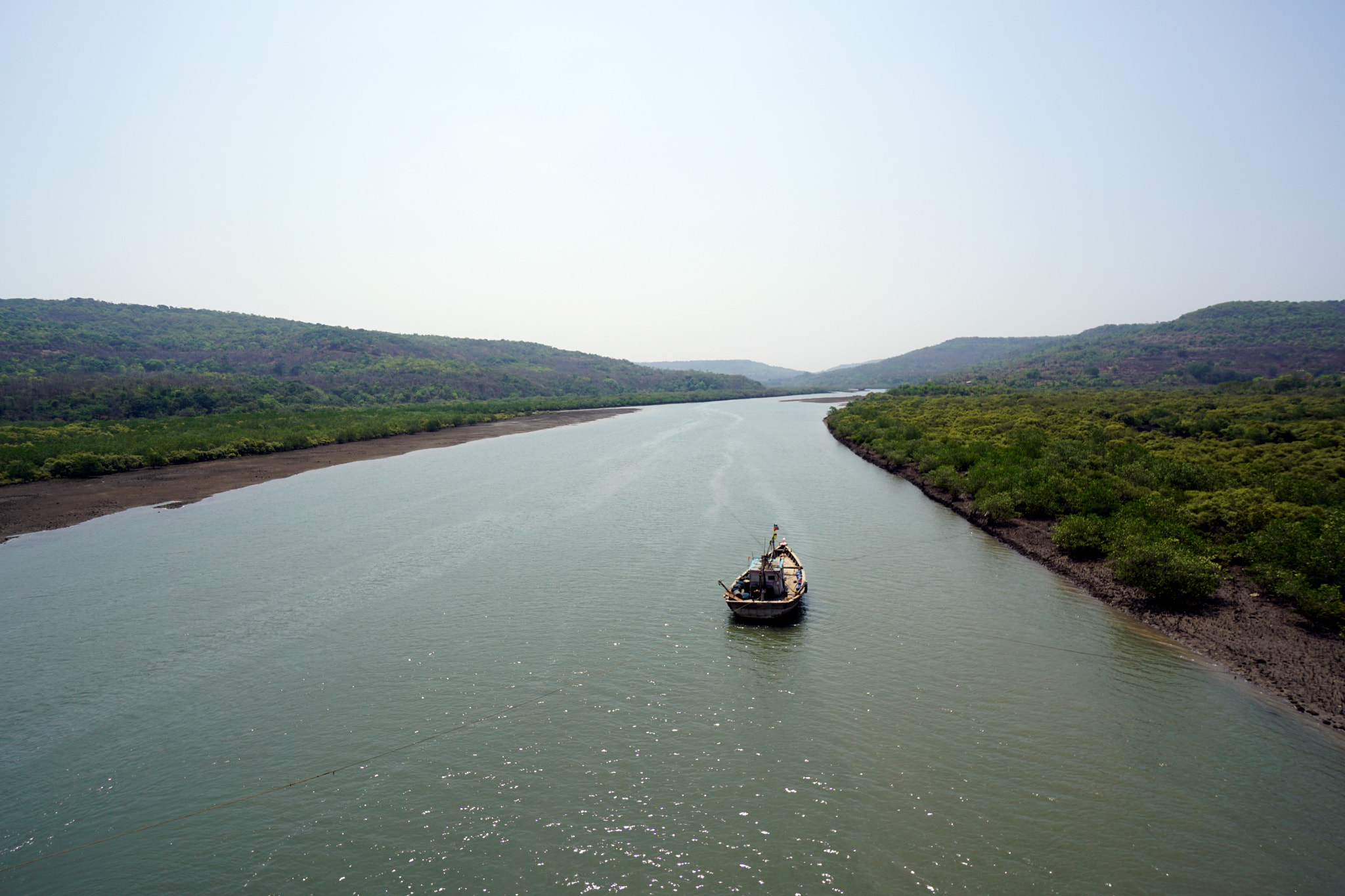 Sony a6000 + Sony E 10-18mm F4 OSS sample photo. Boat on a creek photography