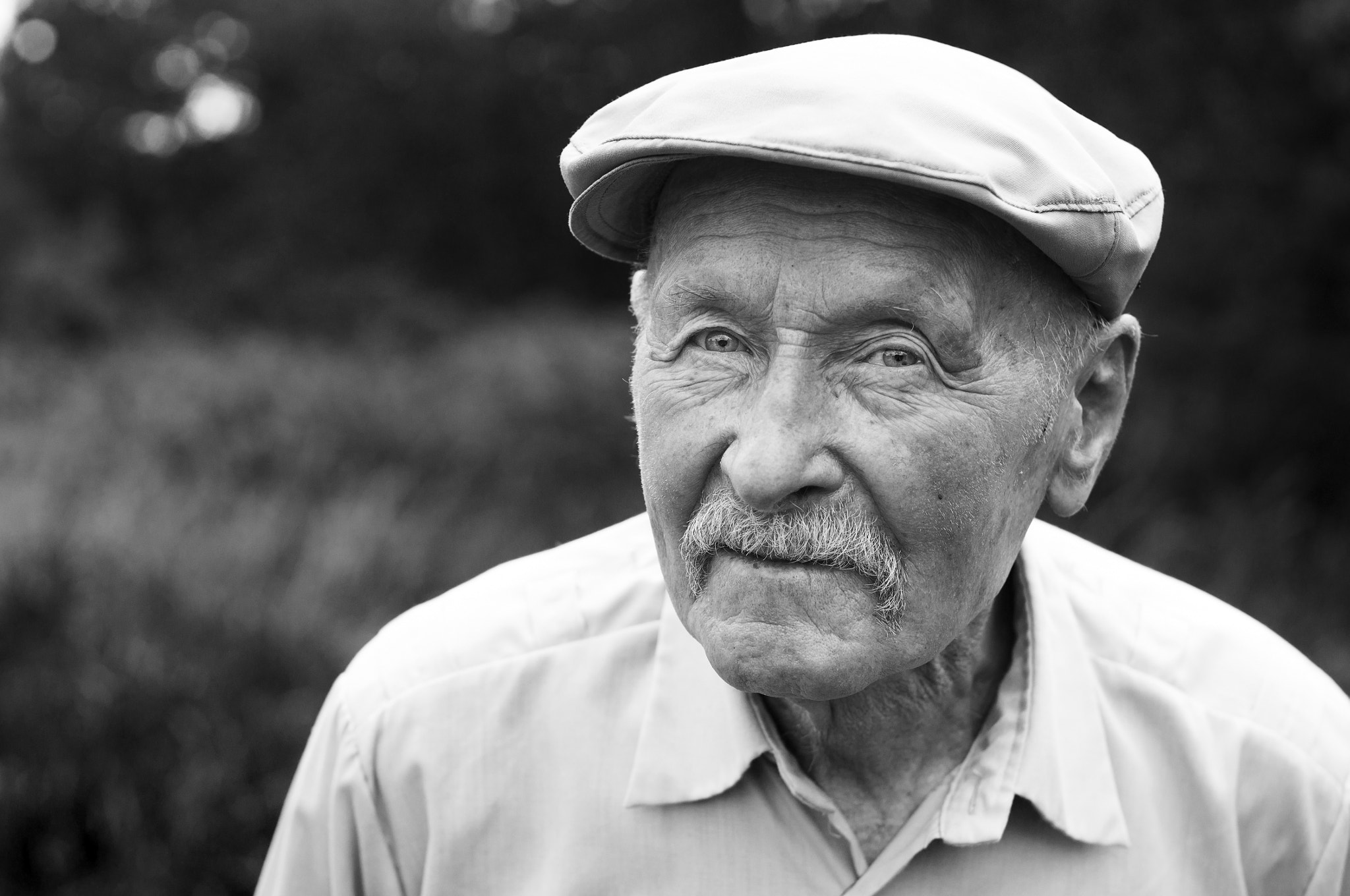 Sony SLT-A57 + Sigma 50mm F1.4 EX DG HSM sample photo. Old man in a cap photography